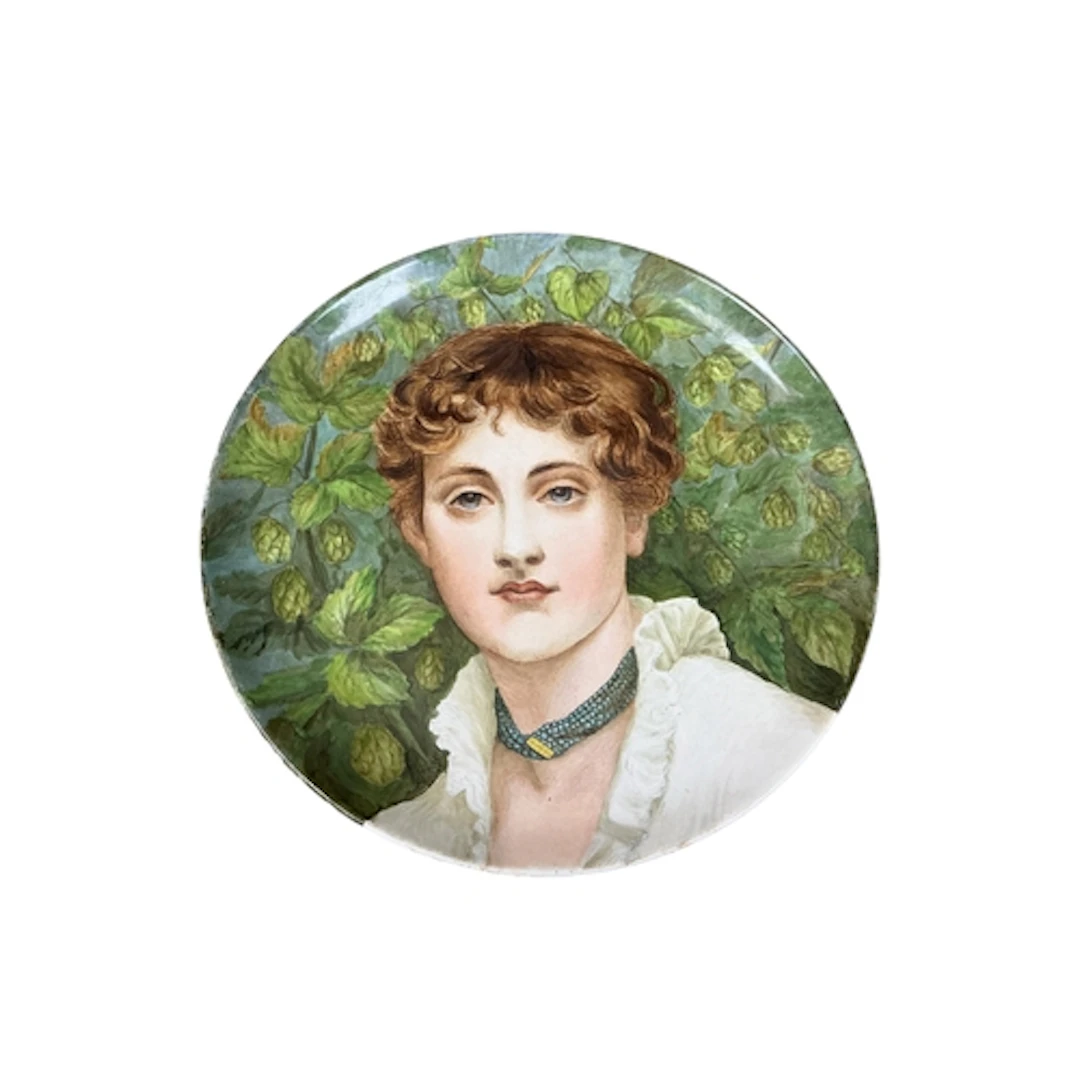 A Victorian Minton charger painted with a portrait of a lady...