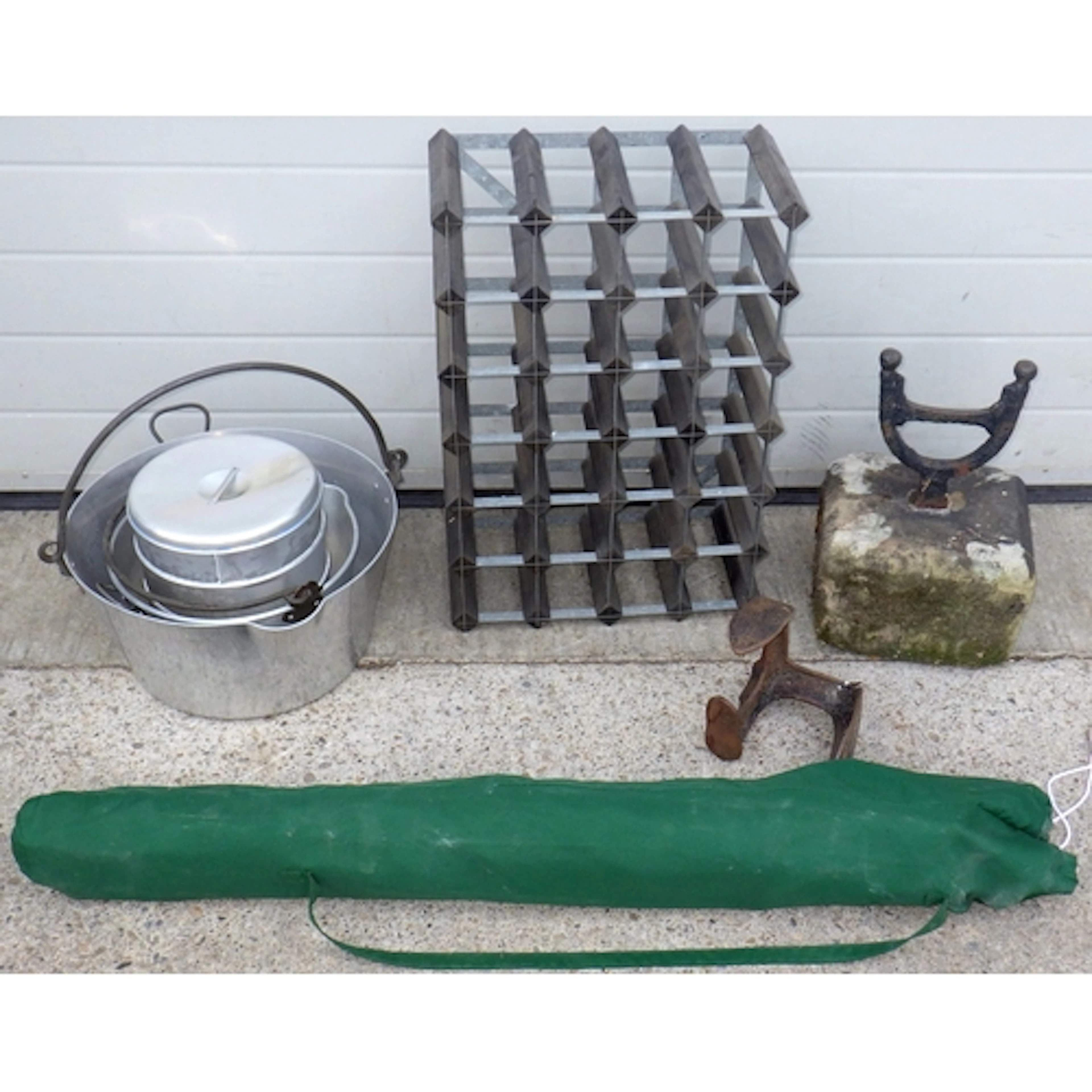 A boot scraper, wine rack, pans, shoe last, umbrella