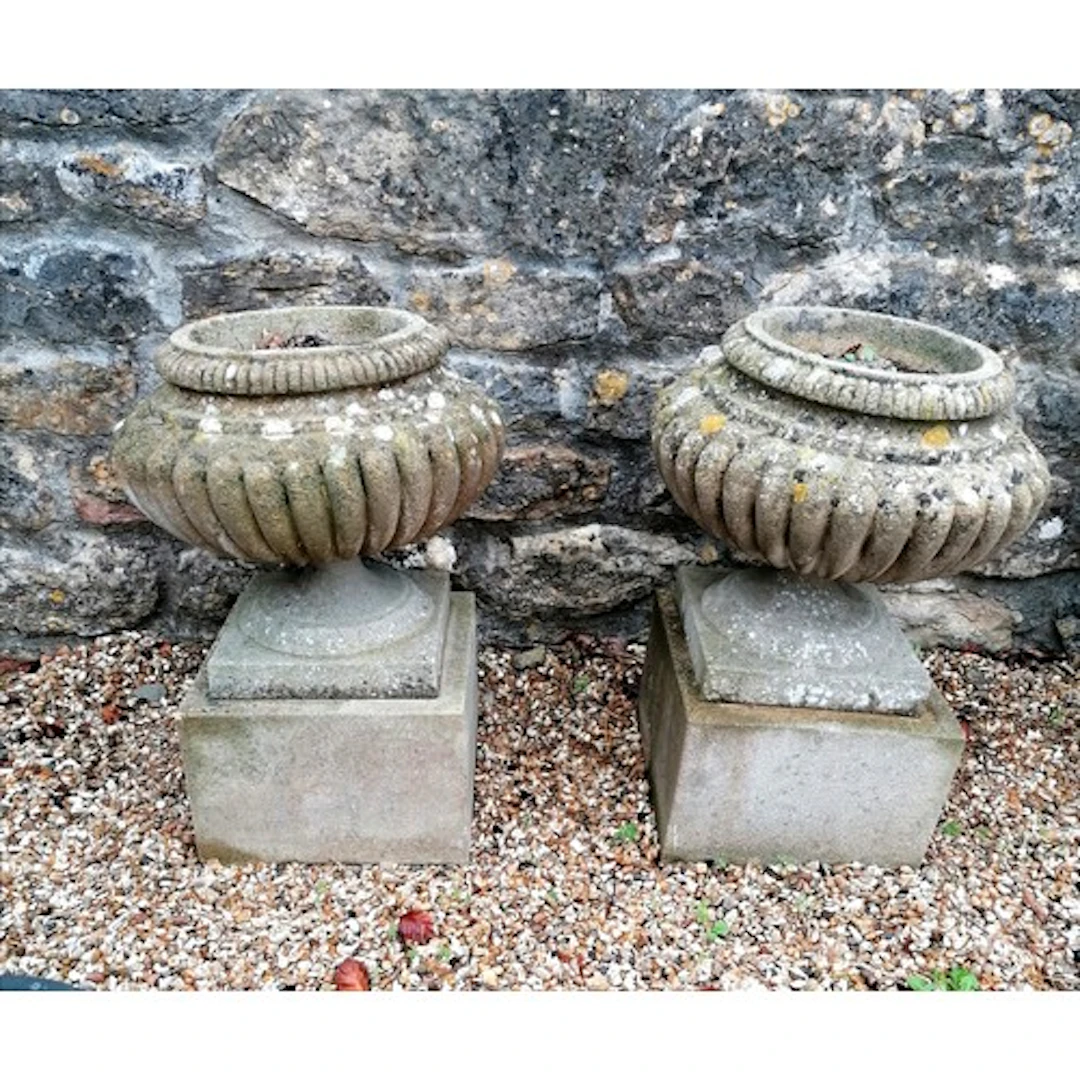 Pair of fluted urns on square pedestals - 40cm x 63cm high
