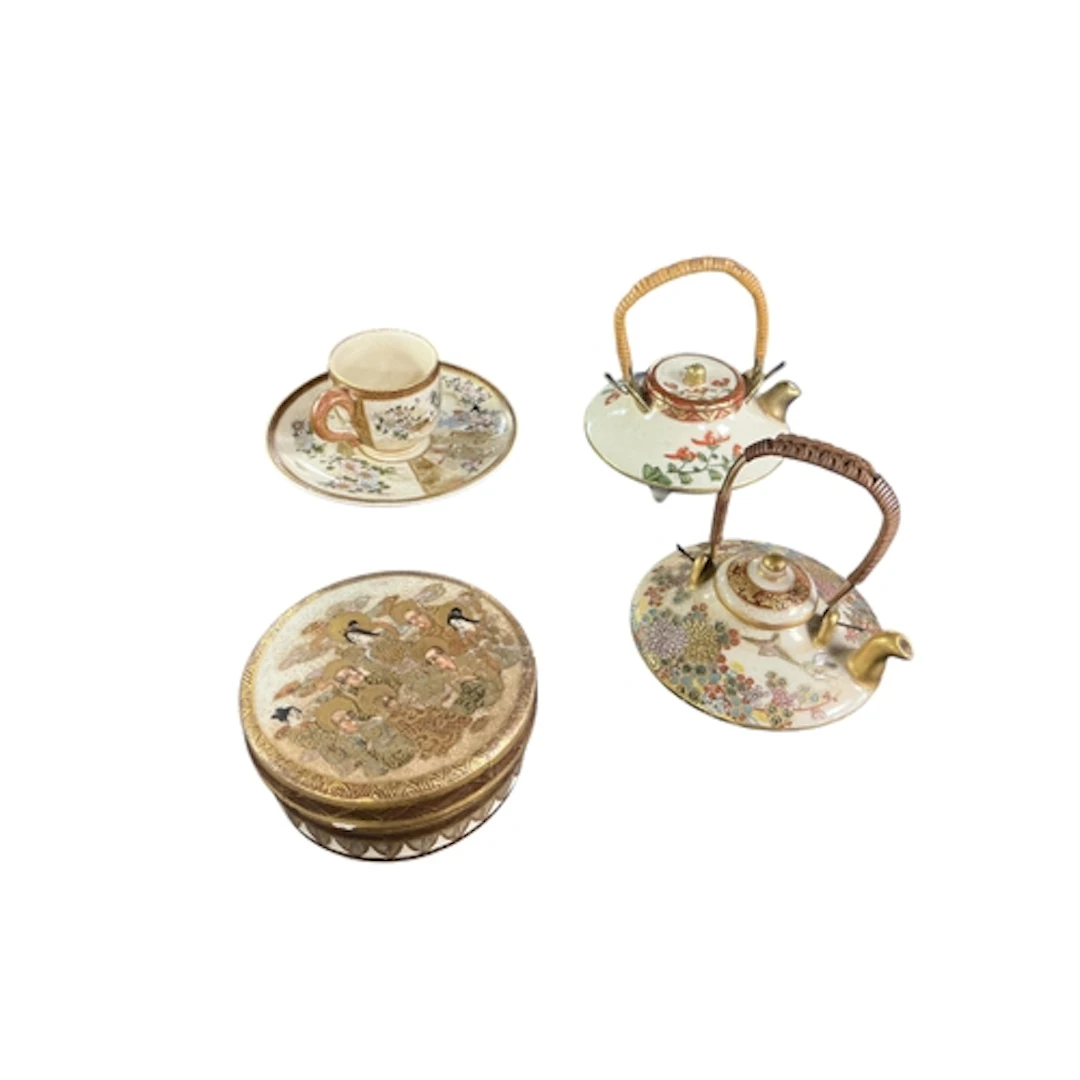 A collection of four pieces of miniature Japanese satsuma po...