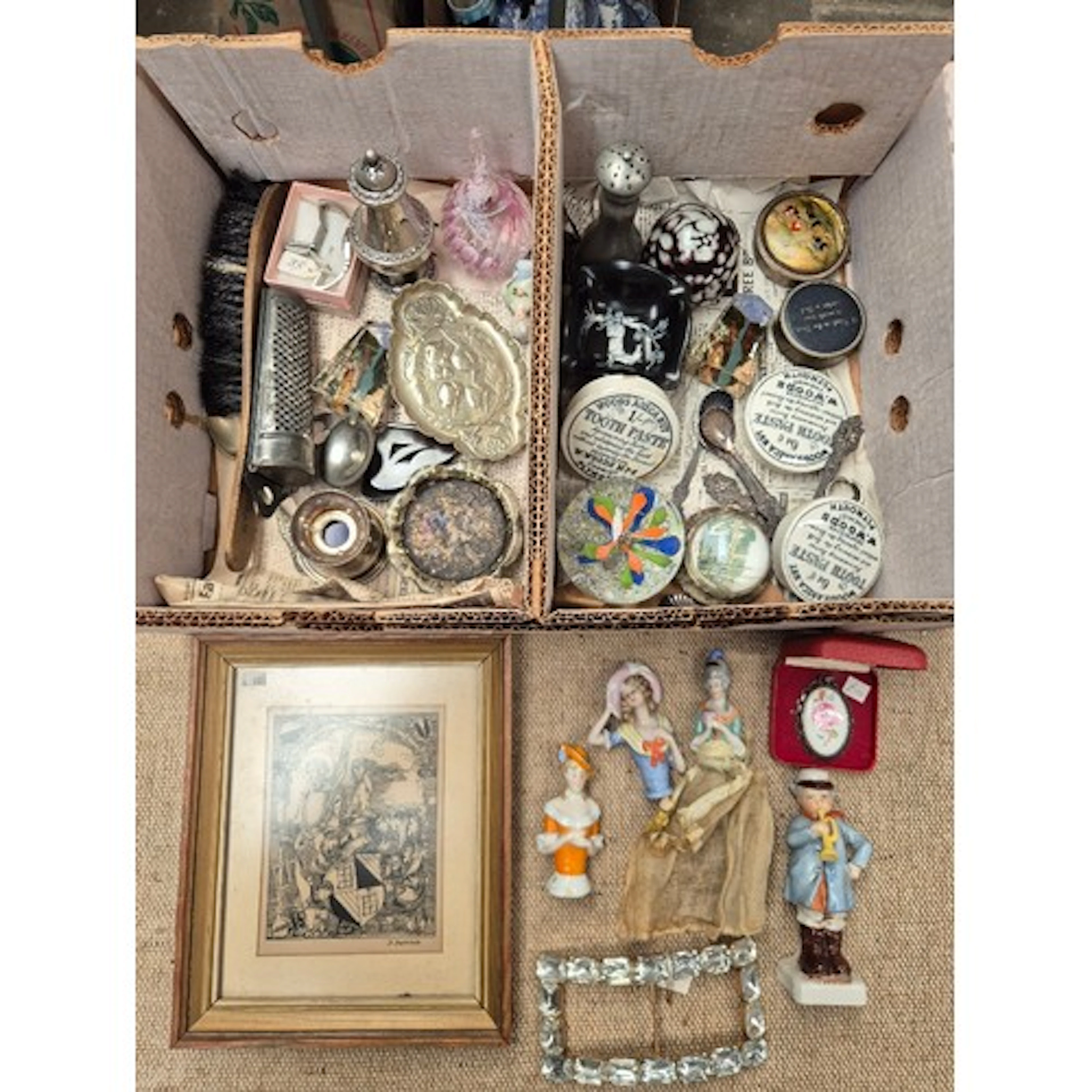 A box of assorted collectables to include glass paperweights...