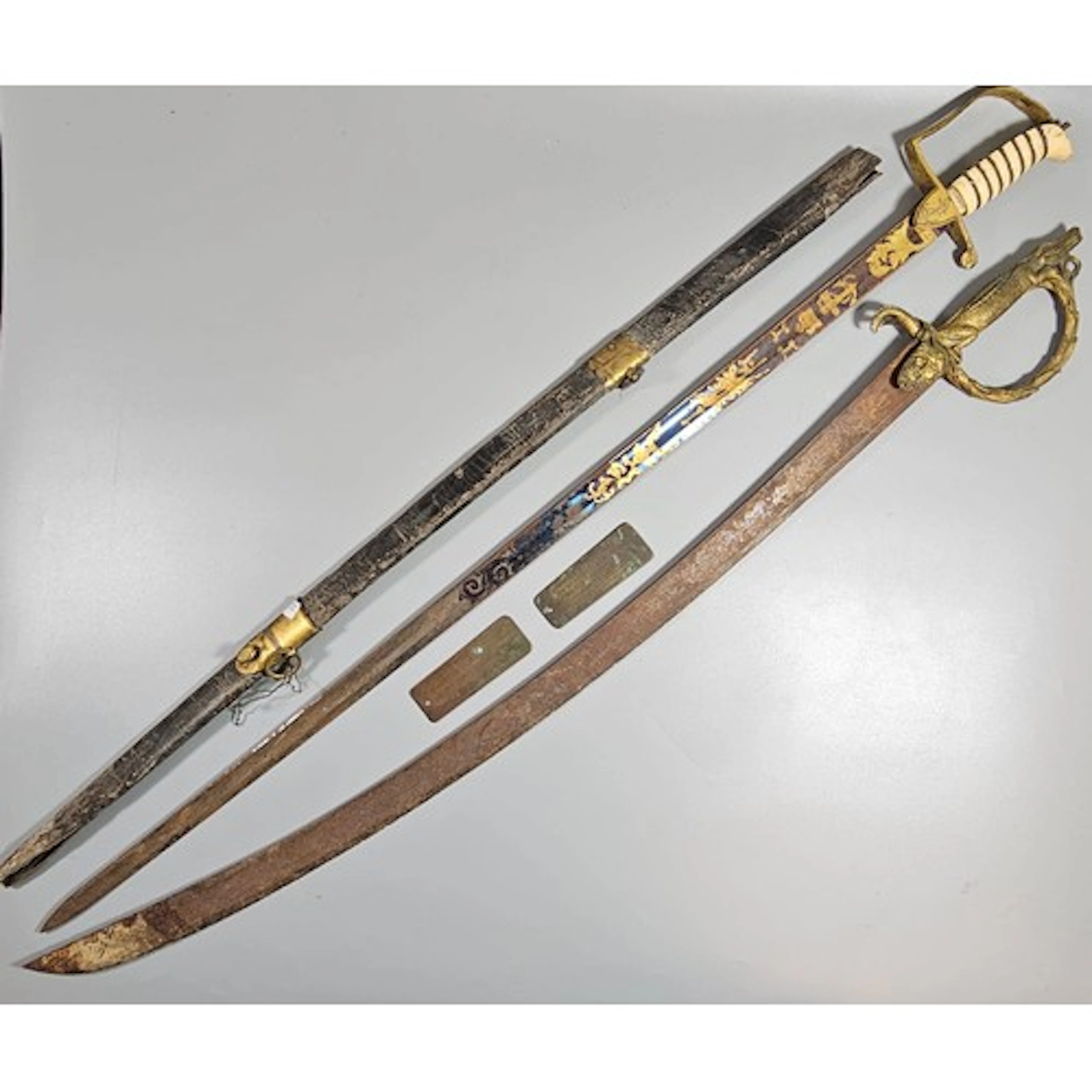Two late 18th century Royal Navy swords, presented to Willia...