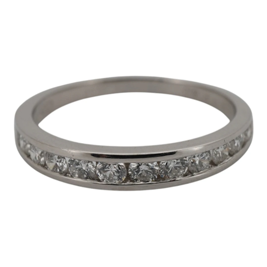 A diamond half eternity ring, channel-set to the front with ...