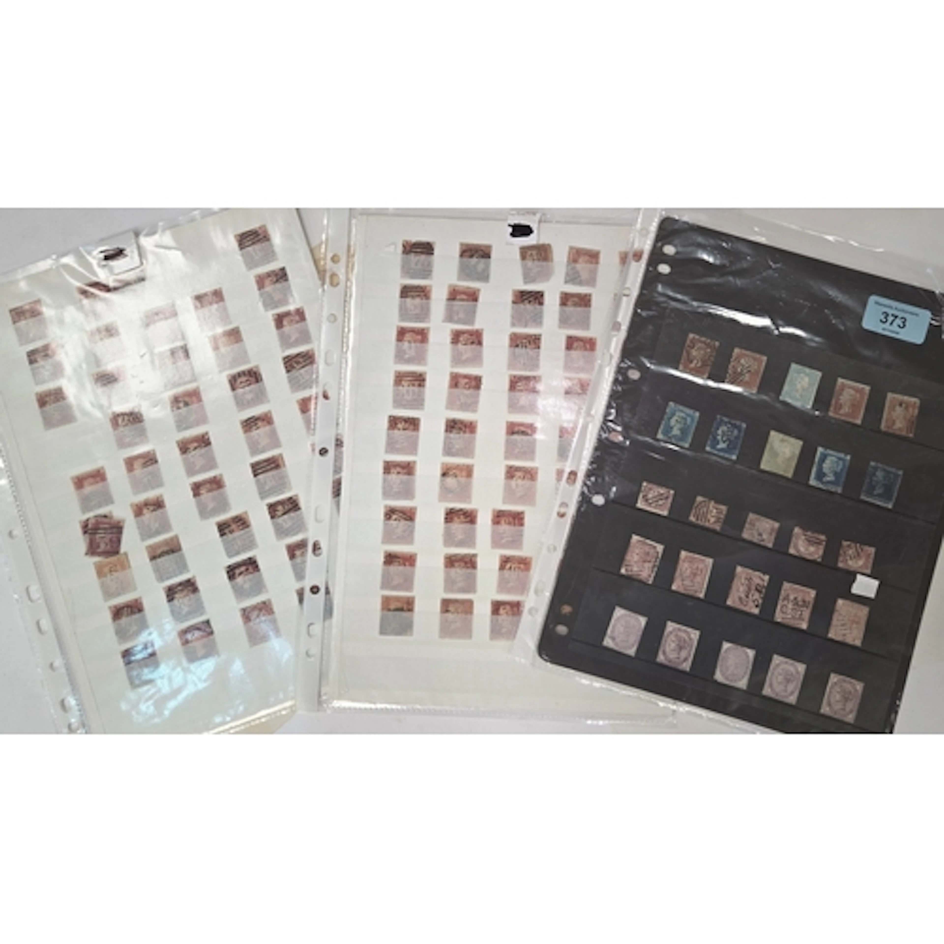Two pages of Penny Red stamps and a sheet of Victorian vario...
