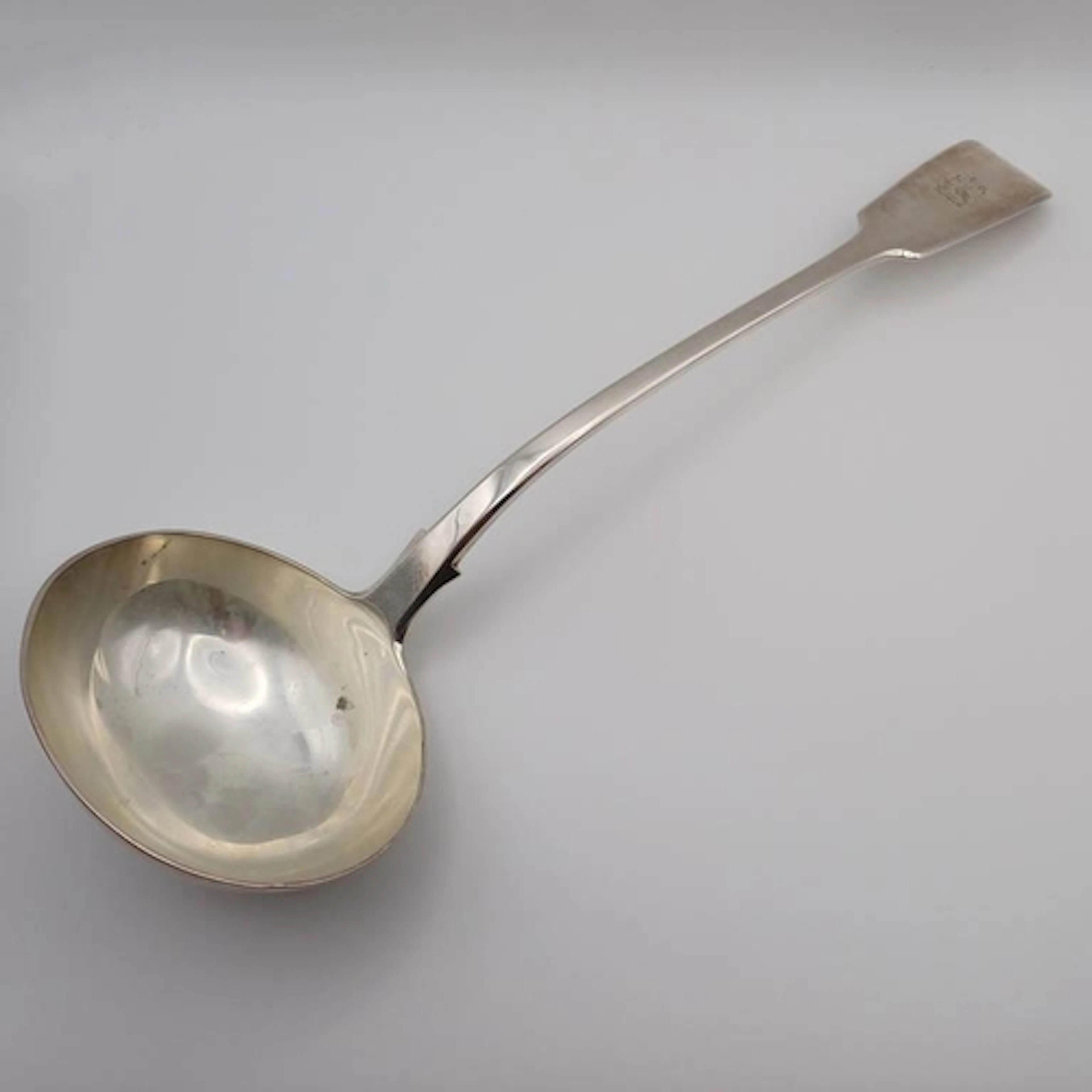 A VICTORIAN SILVER FIDDLE PATTERN SOUP LADLE BY GEORGE ADAMS...