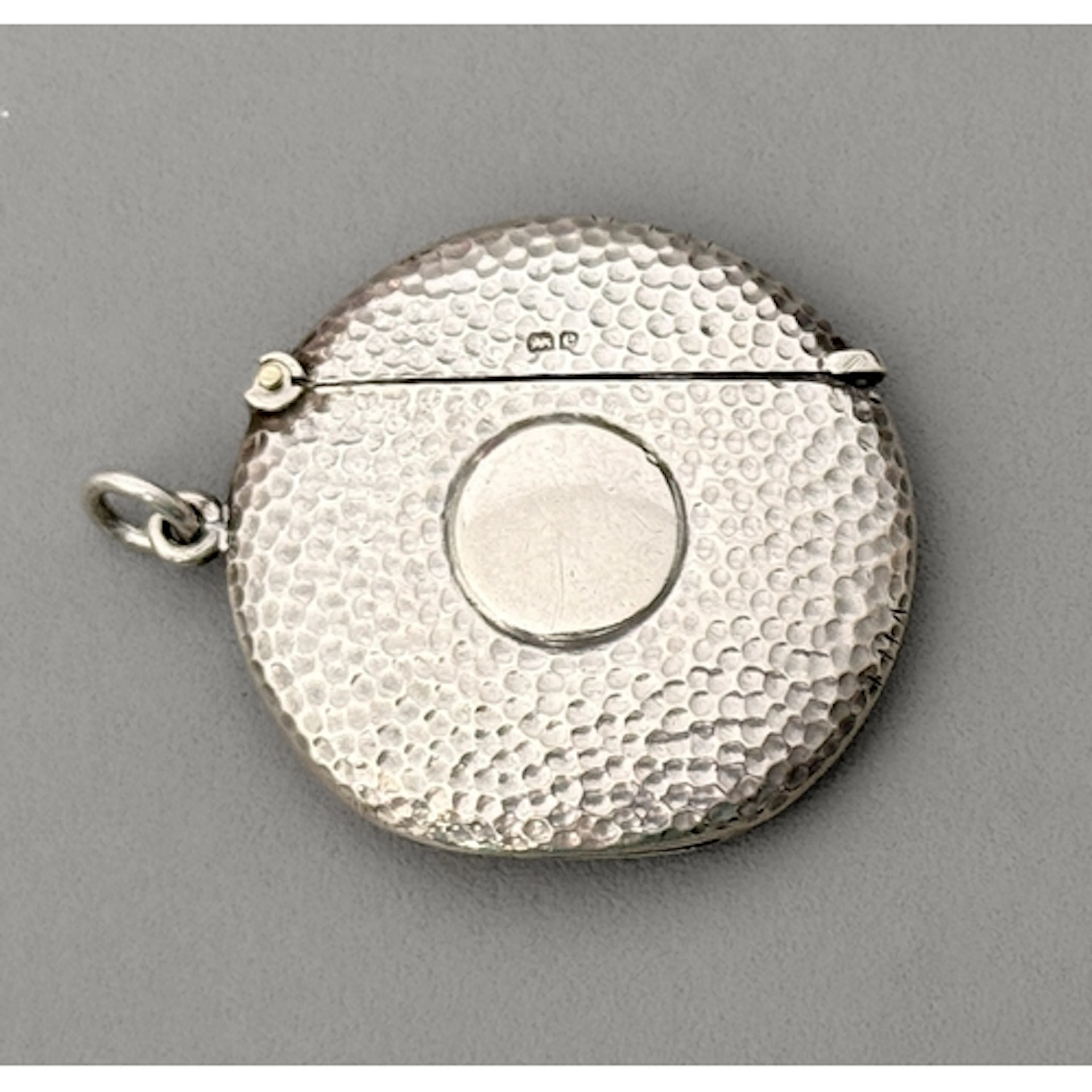 A silver Edwardian golf ball shaped vesta case - in the form...