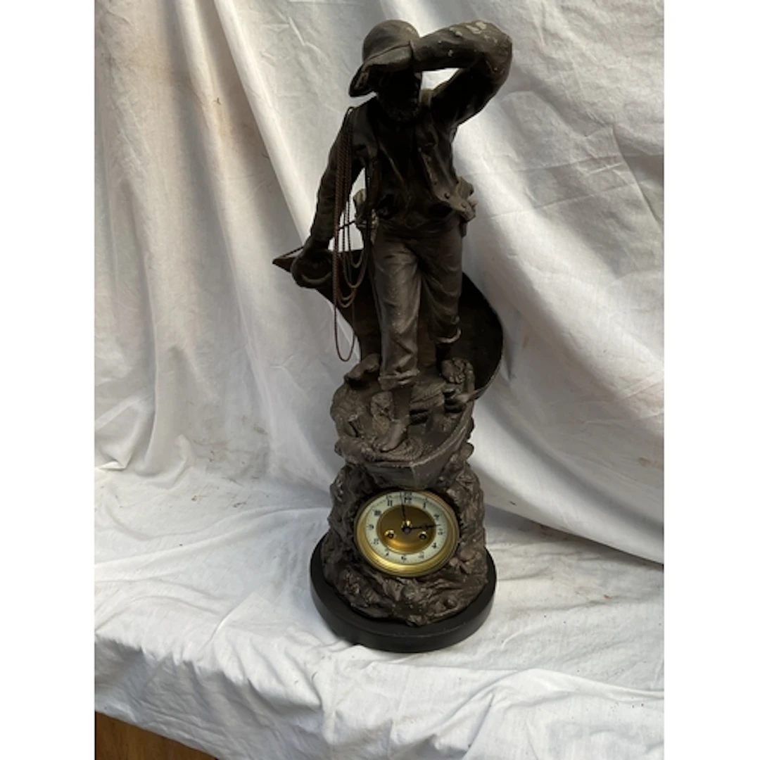 19th C large spelter clock of a mariner on a boat,with a bas...
