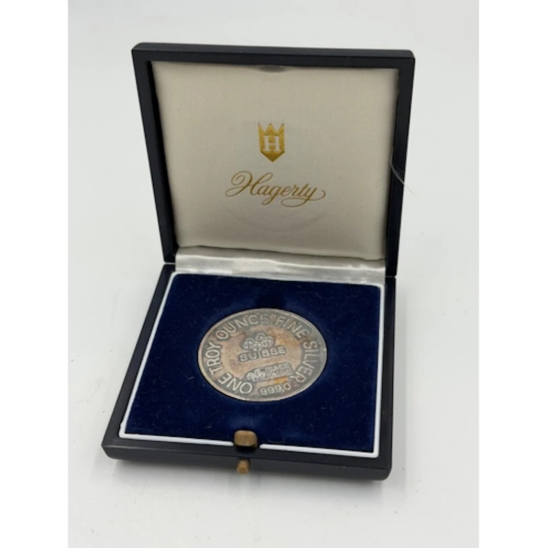 A Hagerty Centenary 1 Troy Ounce silver commemorative medall...