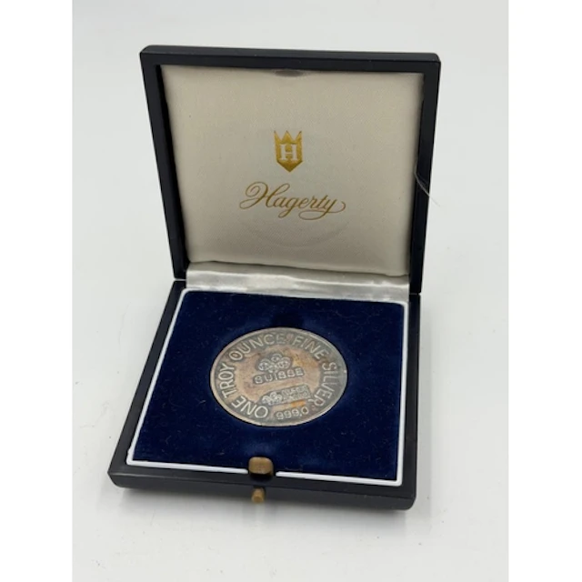 A Hagerty Centenary 1 Troy Ounce silver commemorative medall...