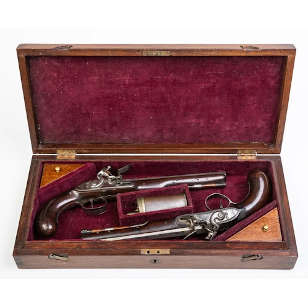 CASED PAIR OF FLINTLOCK PISTOLS BY JOHN EDGSON OF STAMFORD. ...