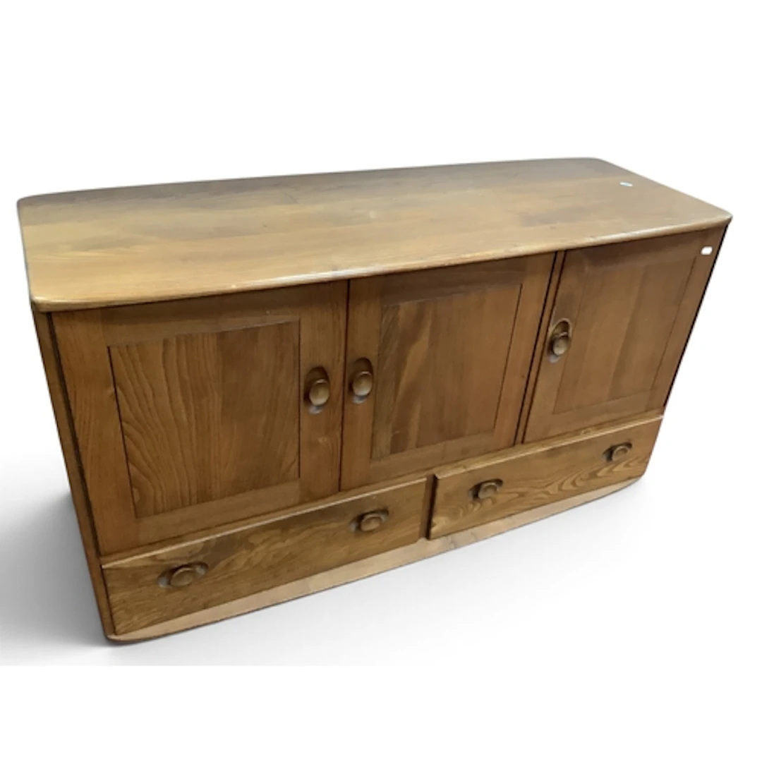 Ercol Blonde Sideboard with oval concave handles to three up...