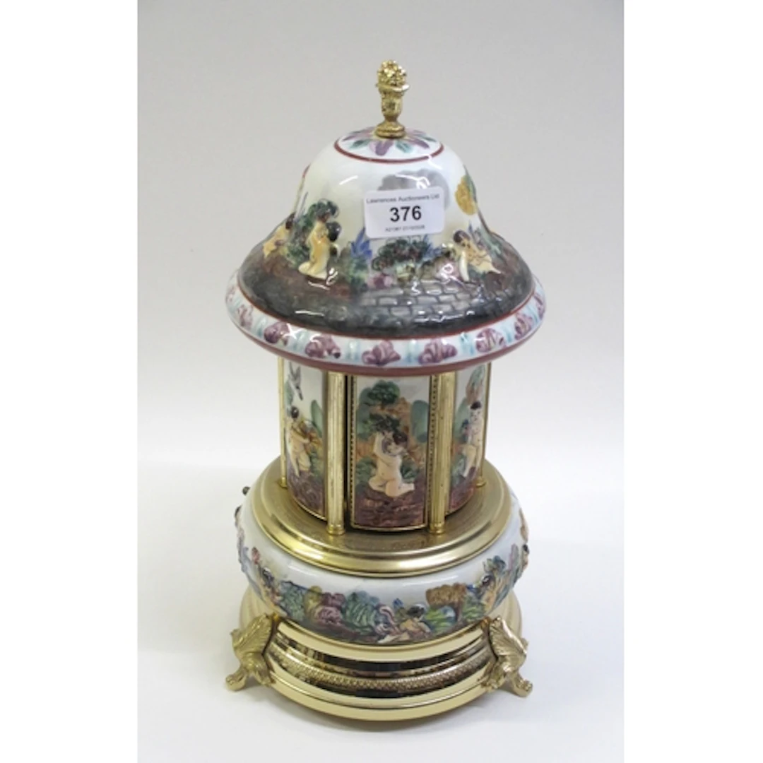 Modern Capodimonte type gilt metal mounted musical cigarette...