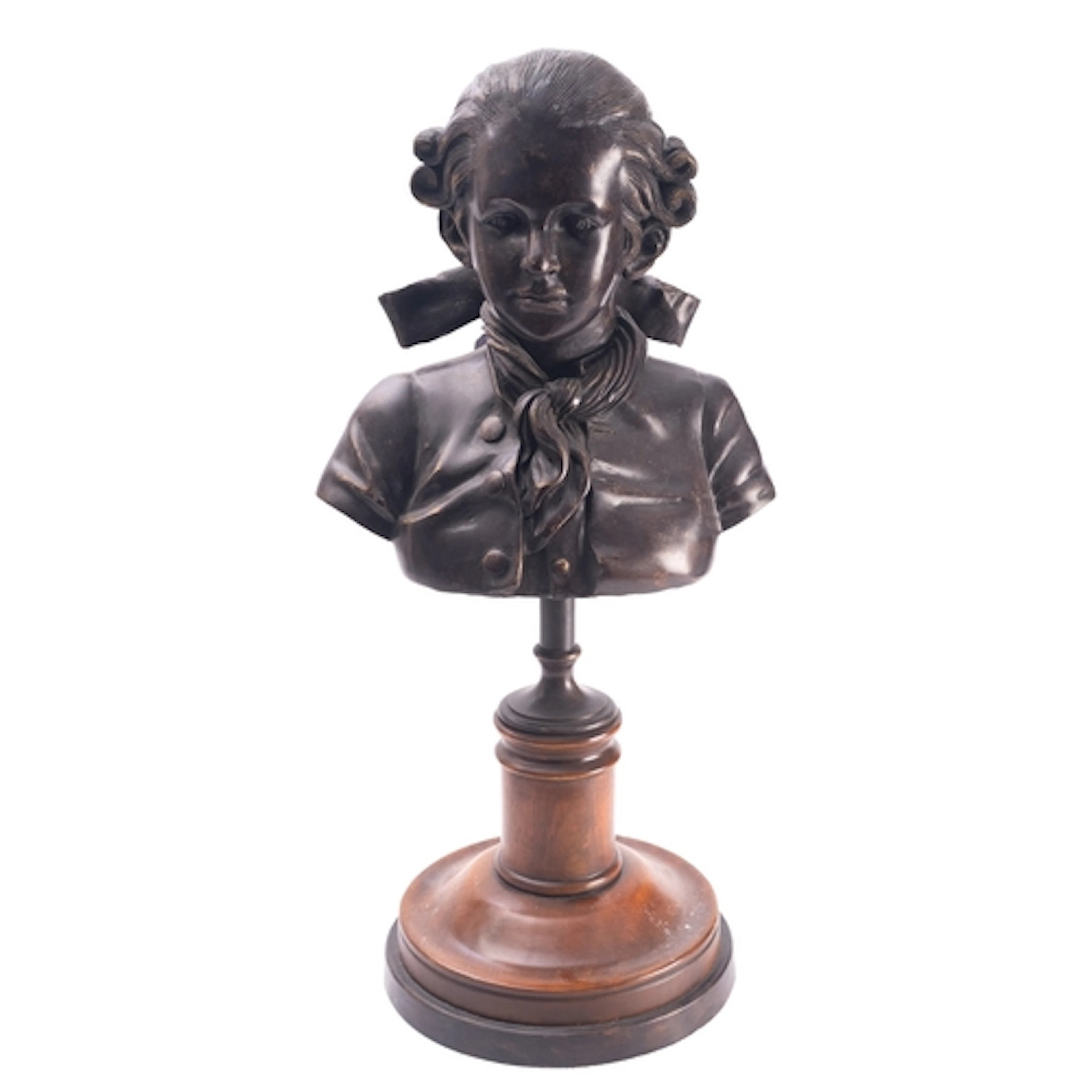 A patinated metal library bust of a boy in 18th century atti...