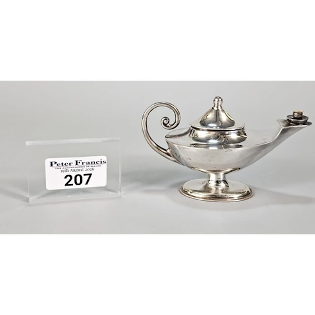 George V novelty silver table lighter in the style of Aladdi...