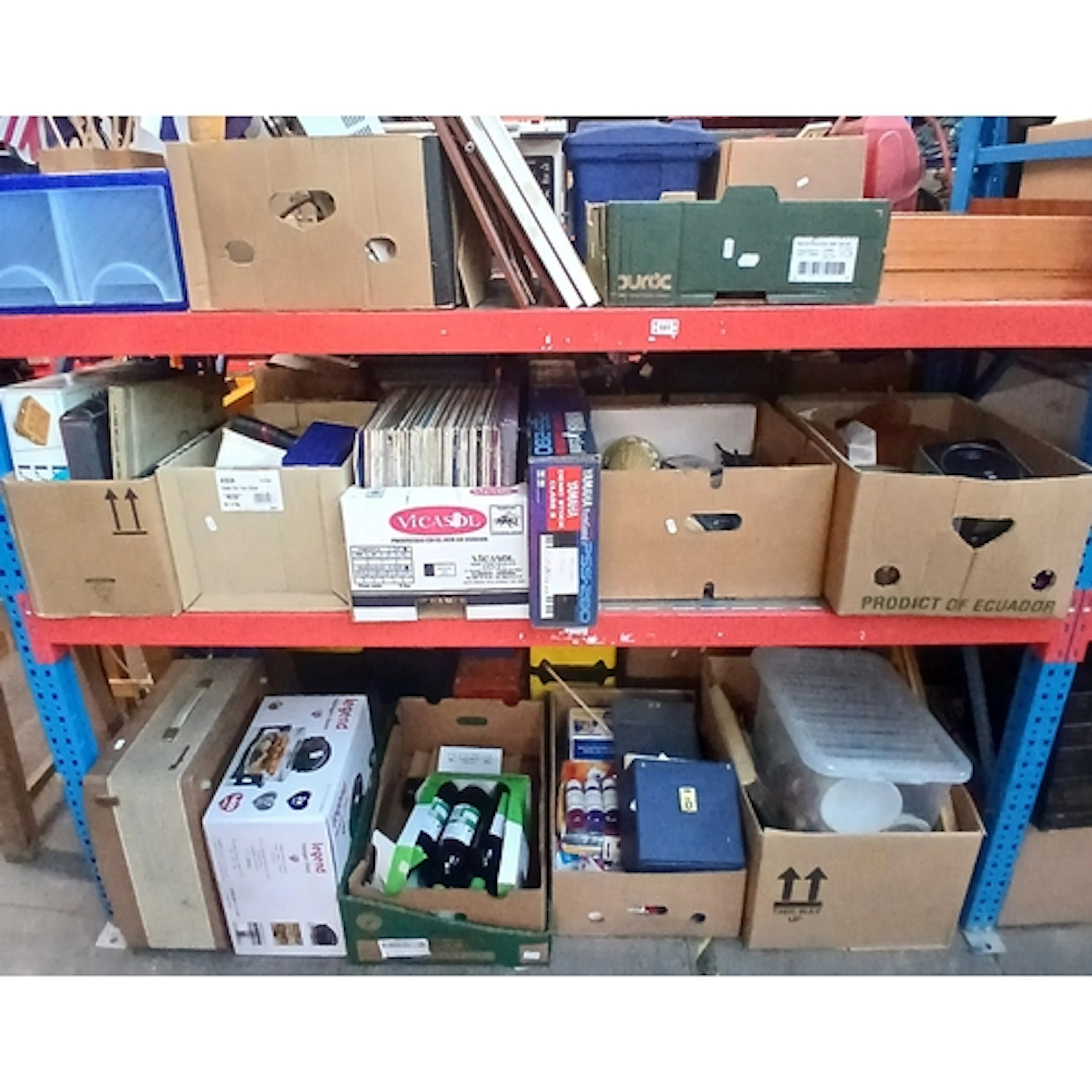 Three shelves of mixed items to include cutlery, prints, Yam...