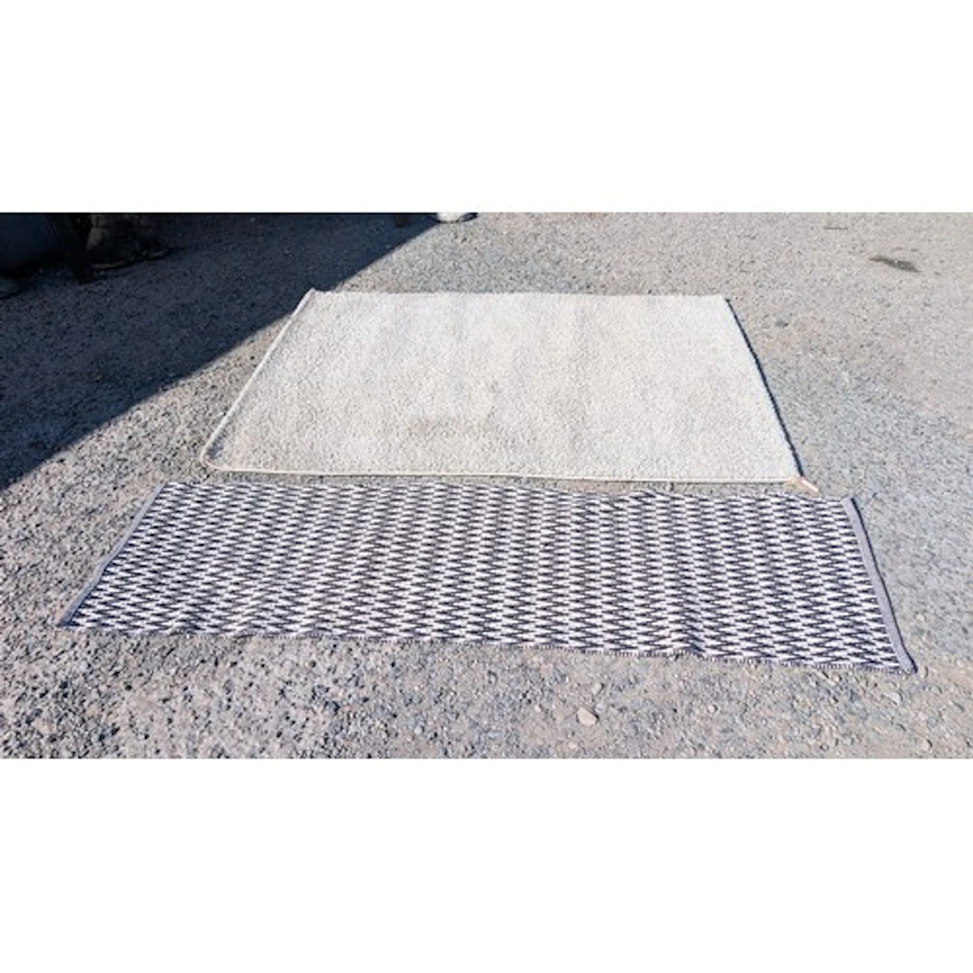 Black and white chevron-patterned runner rug; together with ...
