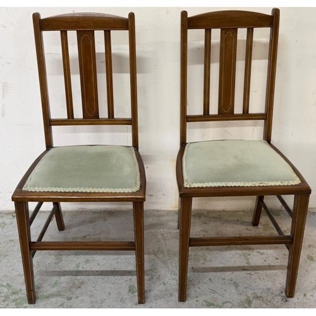 A pair of Edwardian style side chairs featuring inlaid strin...