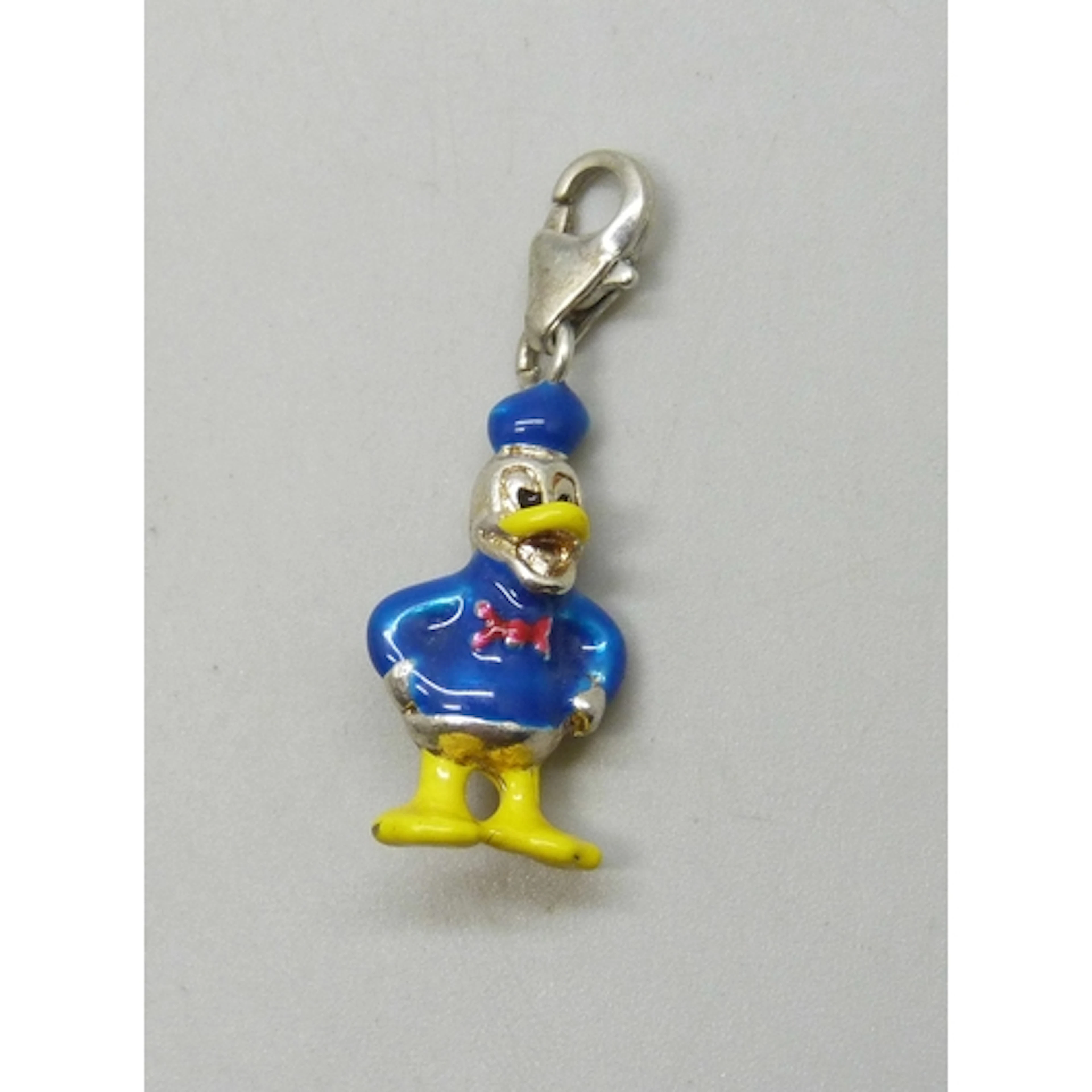 A Donald Duck silver and enamel charm, 3.3cm including clasp