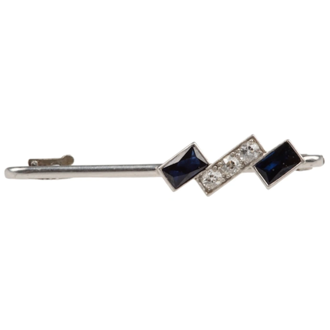 An Art Deco sapphire and diamond bar brooch, 1920s, set to o...