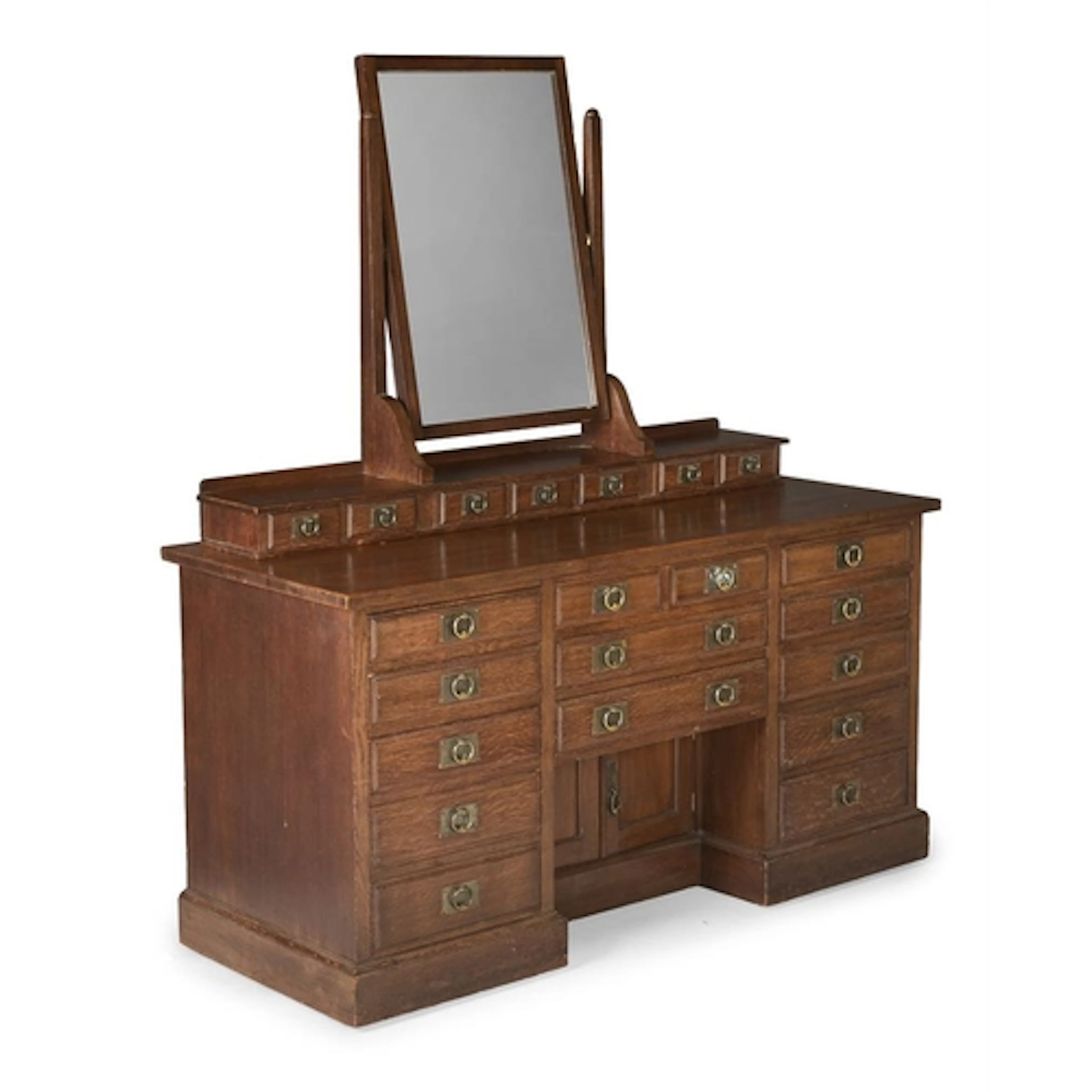 An arts and crafts oak mirror backed dressing chest, having ...