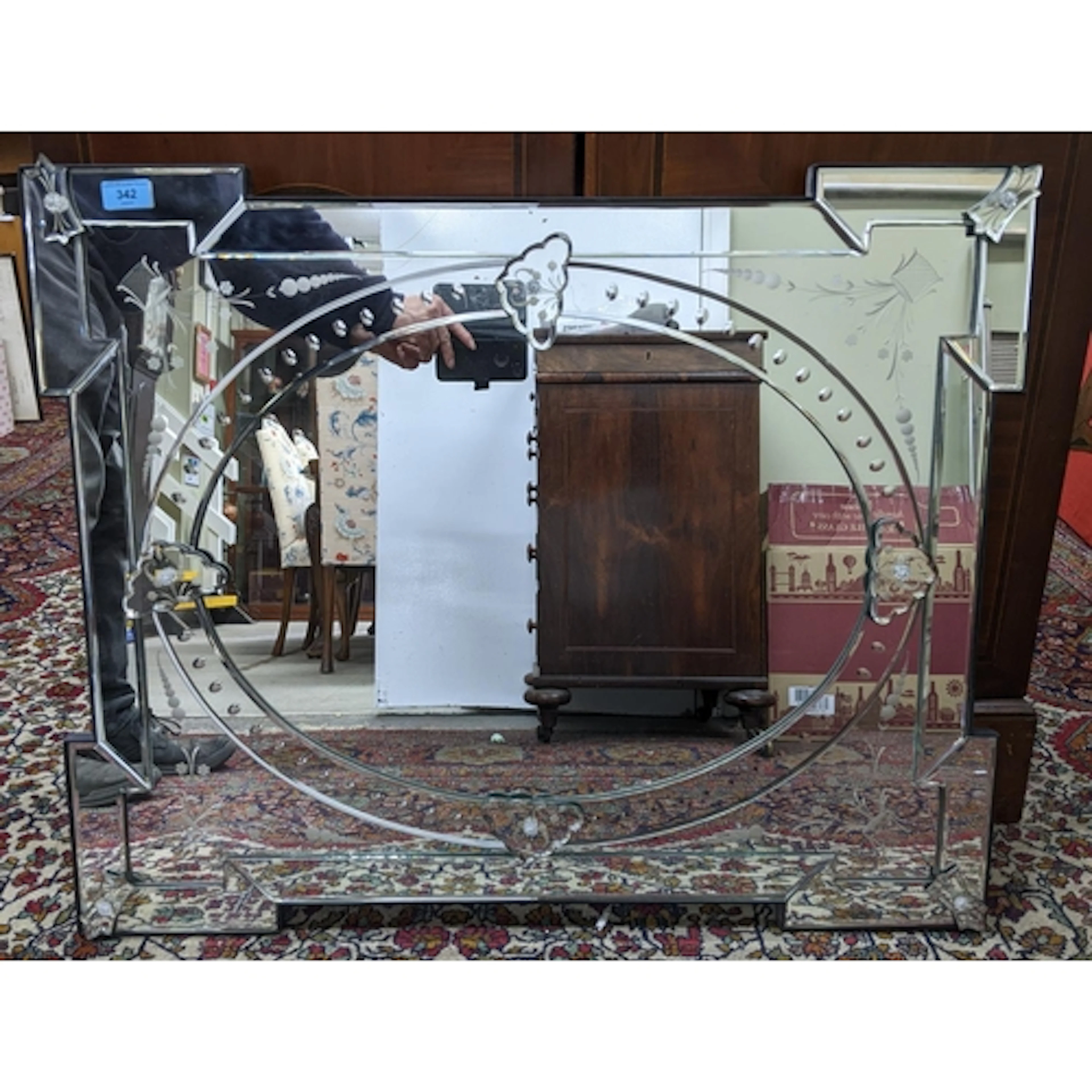A contemporary Venetian style glass wall mirror, with cut an...