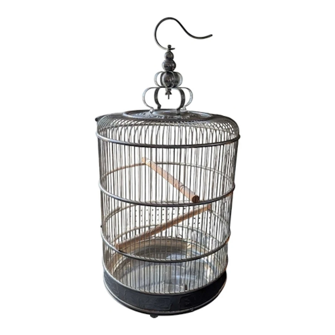 A vintage 20th century Chinese metal bird cage. The cage hav...