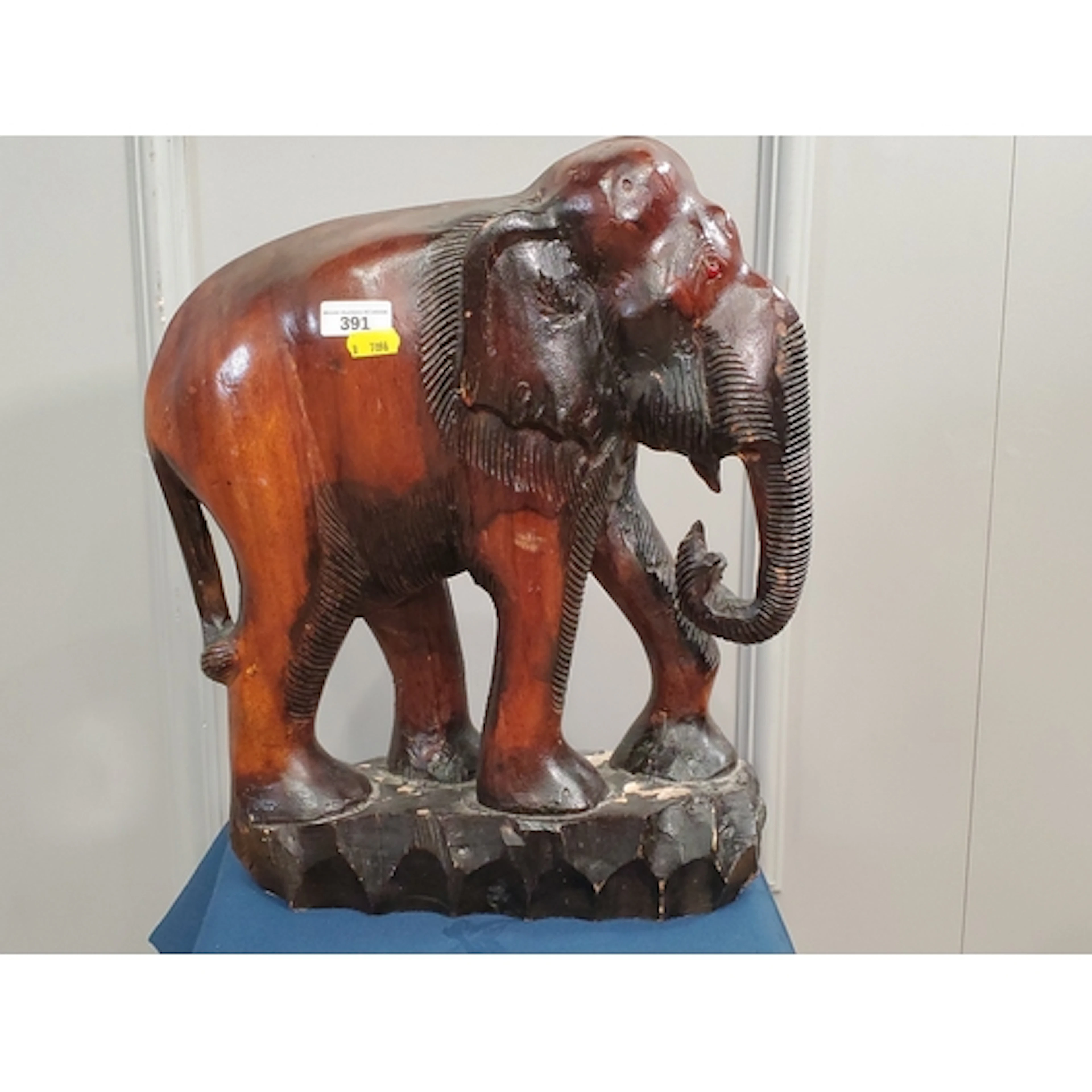 A carved wooden figure of an Elephant, (R2).