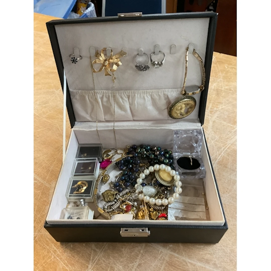 Jewellery box of dress jewellery and gold tooth.