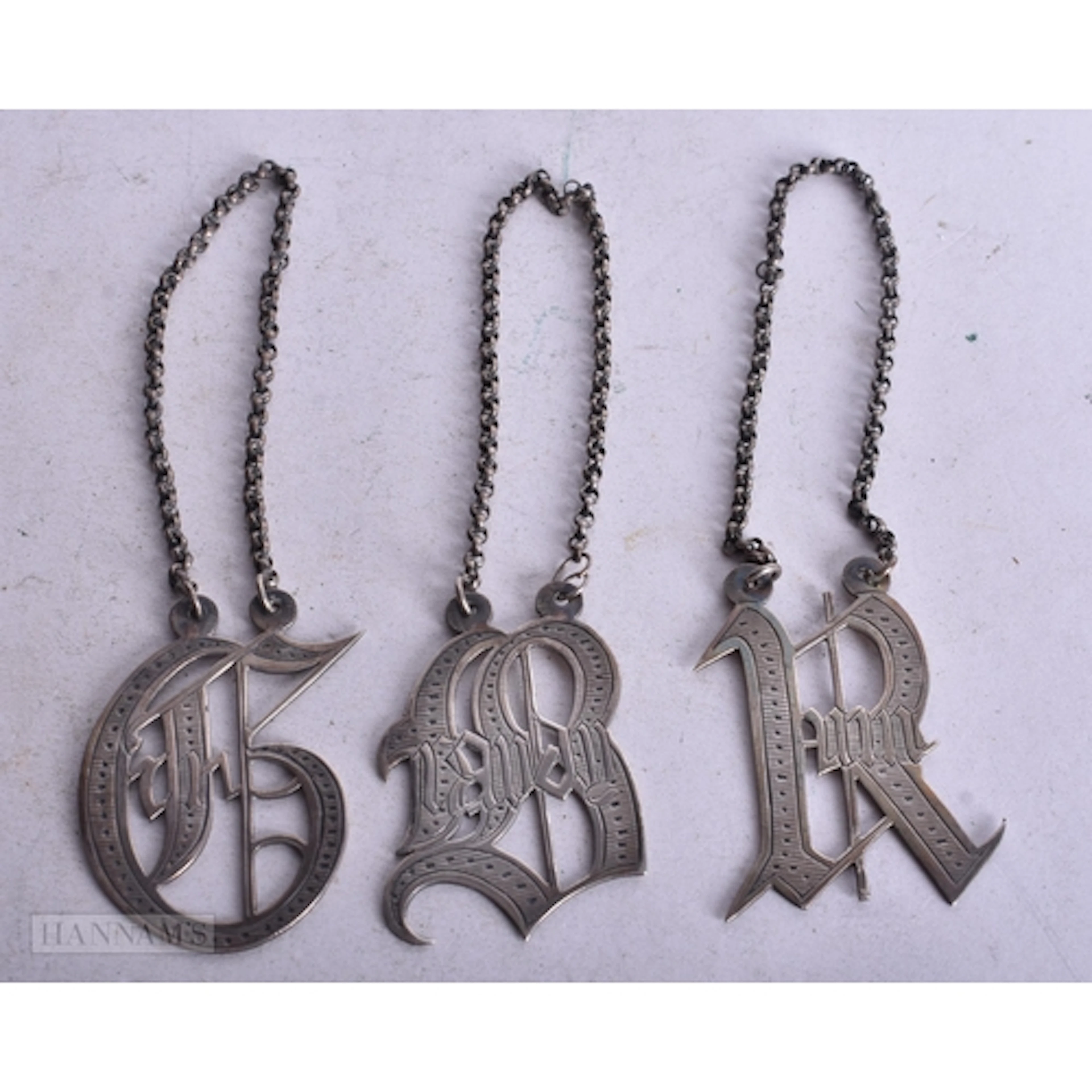 VICTORIAN SILVER DECANTER LABELS. 29 grams. (3)