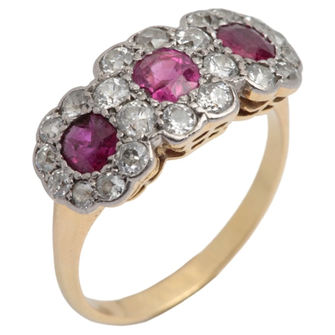 A ruby and diamond ring, early 20th century, designed as a r...