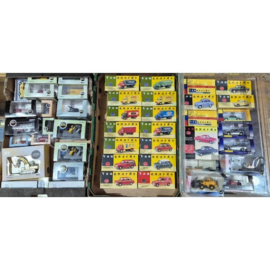 Three boxes of assorted diecast vehicles to include Vanguard...