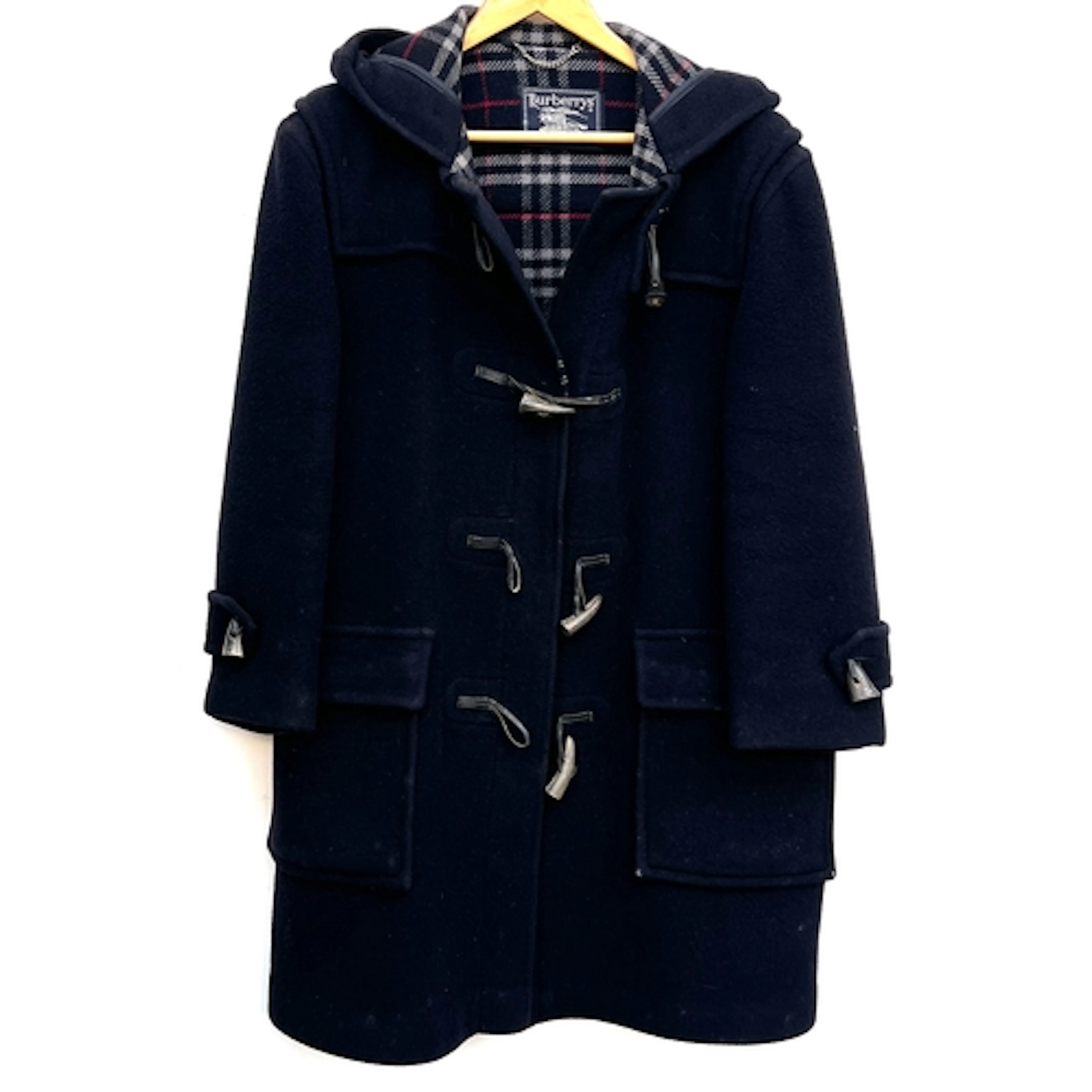 A Burberrys navy blue duffel coat with tartan lining and hor...