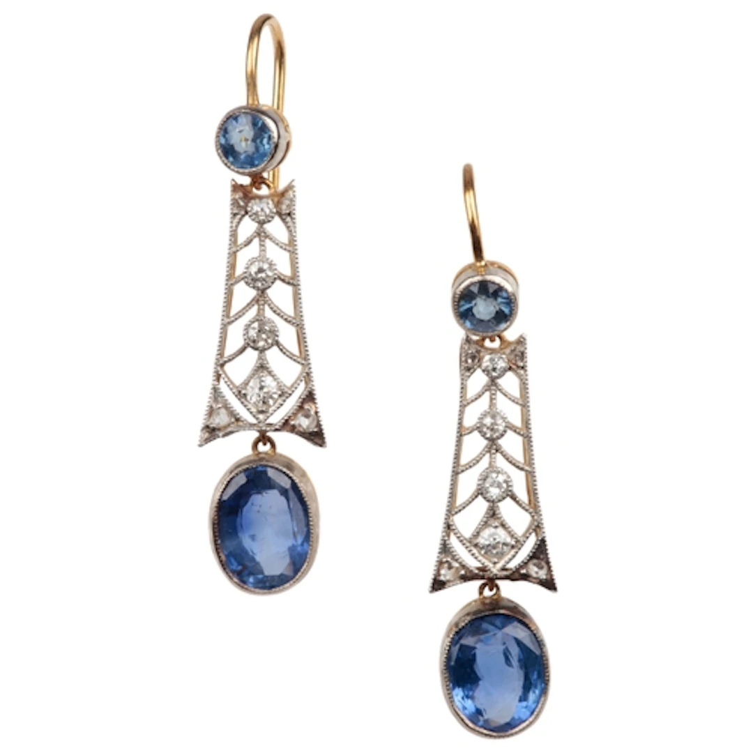 A pair of sapphire and diamond earrings, each suspending an ...