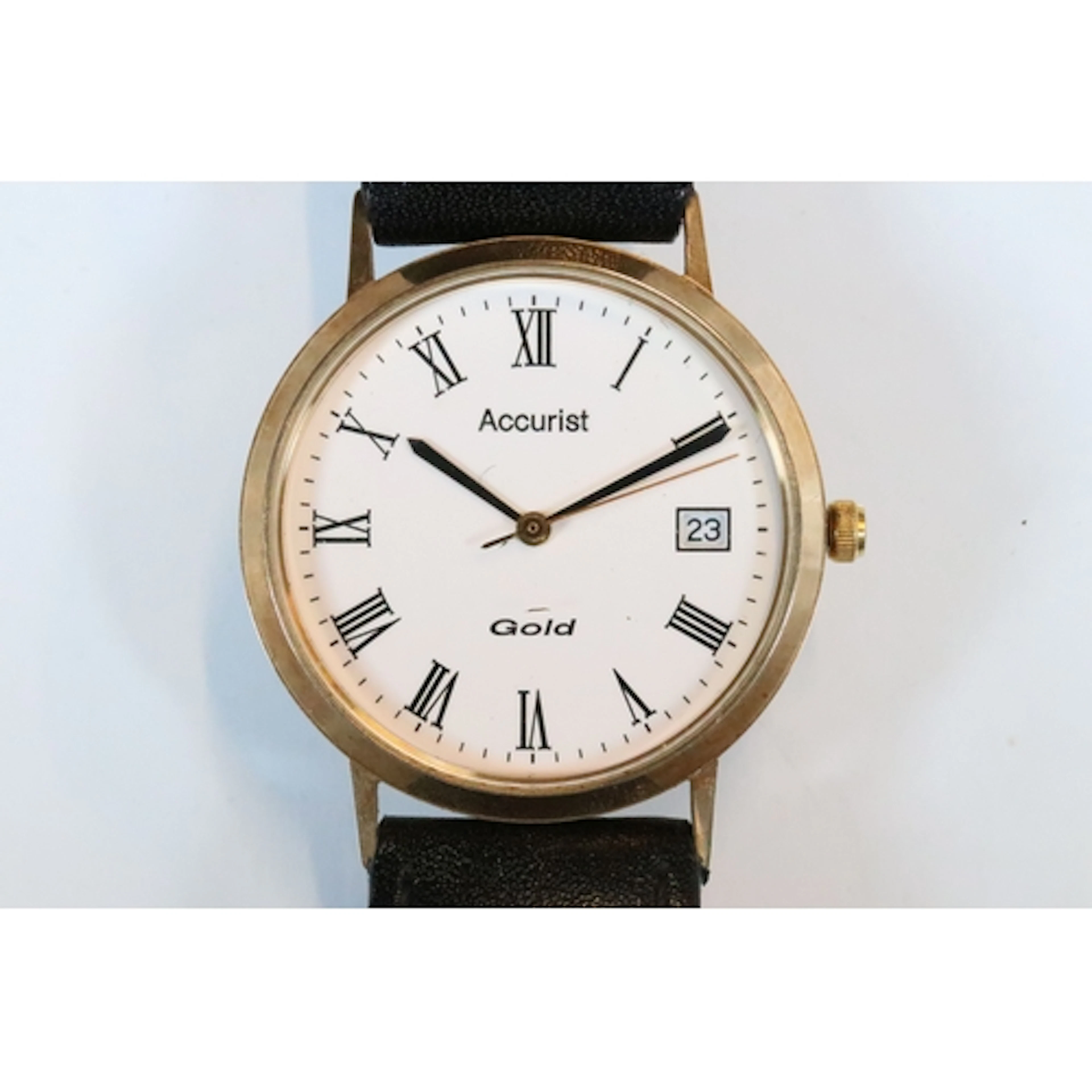9ct gold Accurist wrist watch having a round face with white...
