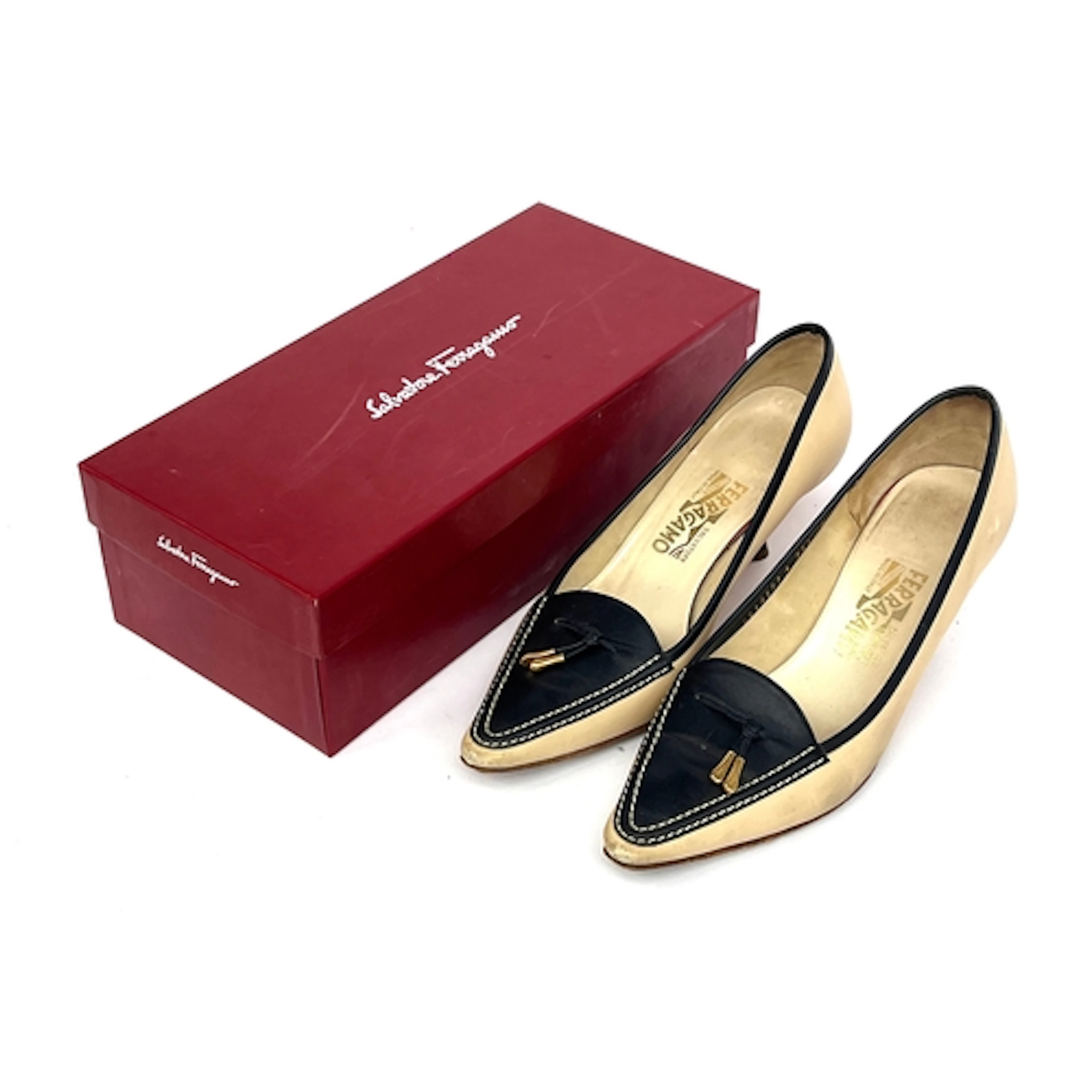 A pair of Salvatore Ferragamo cream and navy leather heels w...