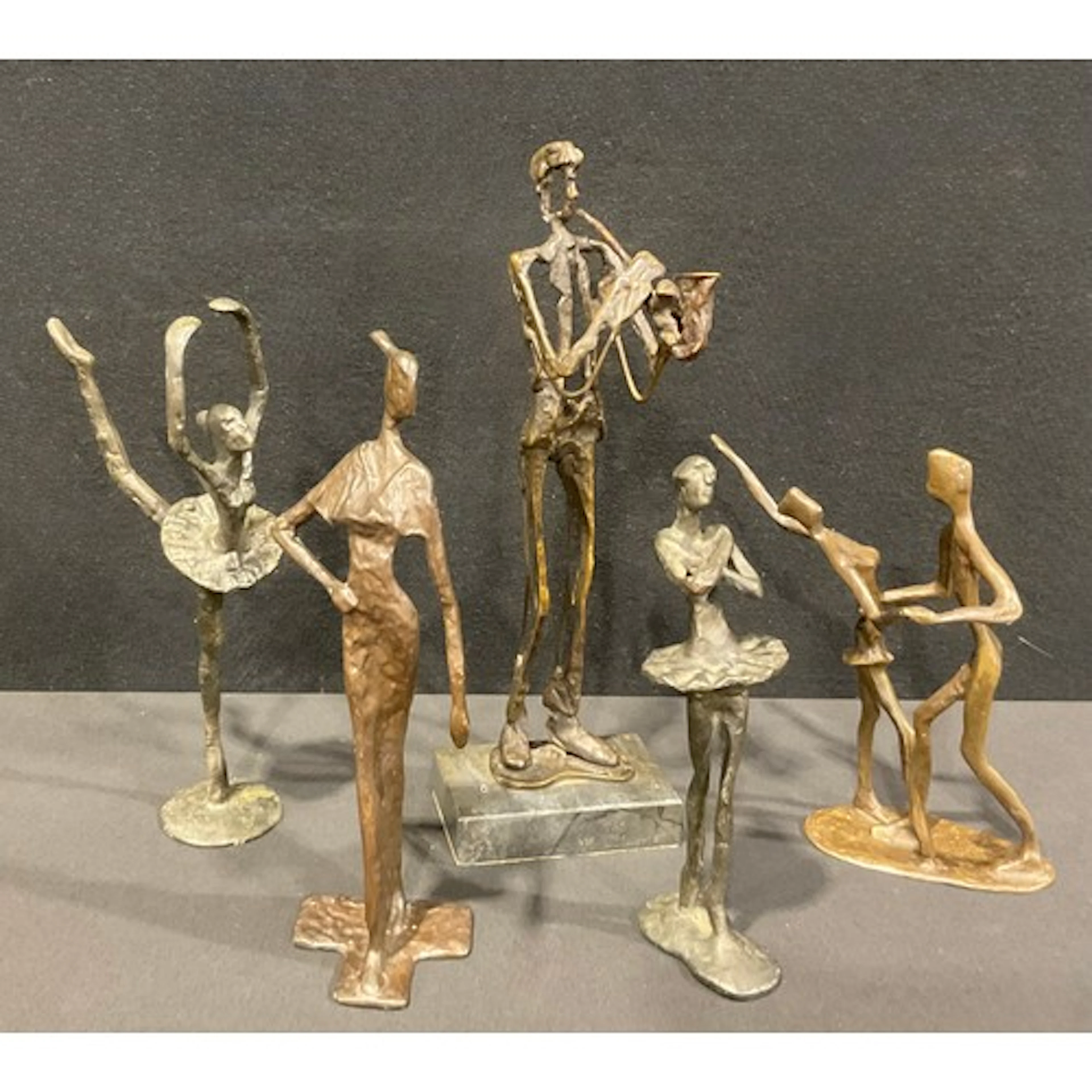 Five contemporary bronze sculptures including a jazz saxopho...