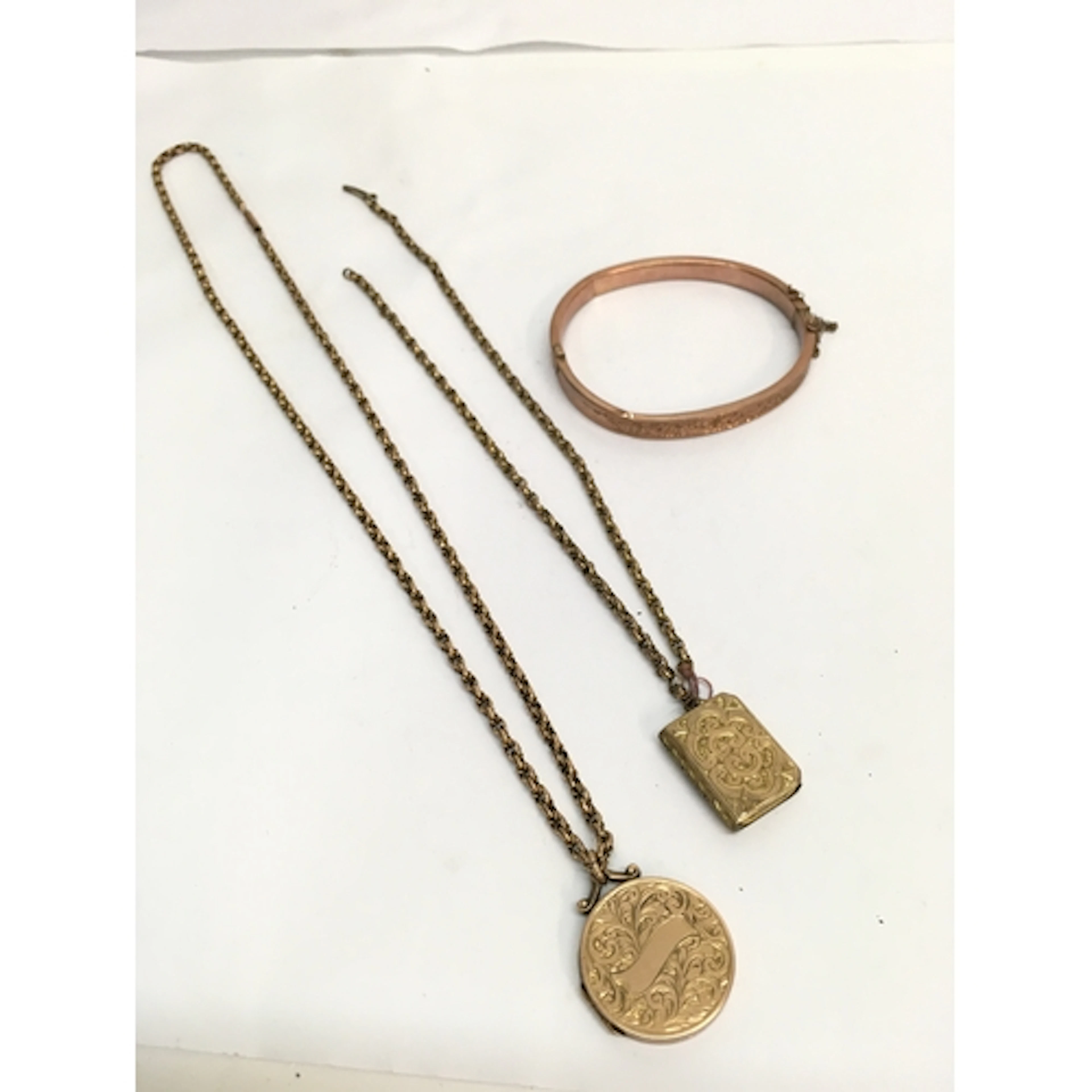 A 9ct gold Victorian locket plus another yellow metal exampl...