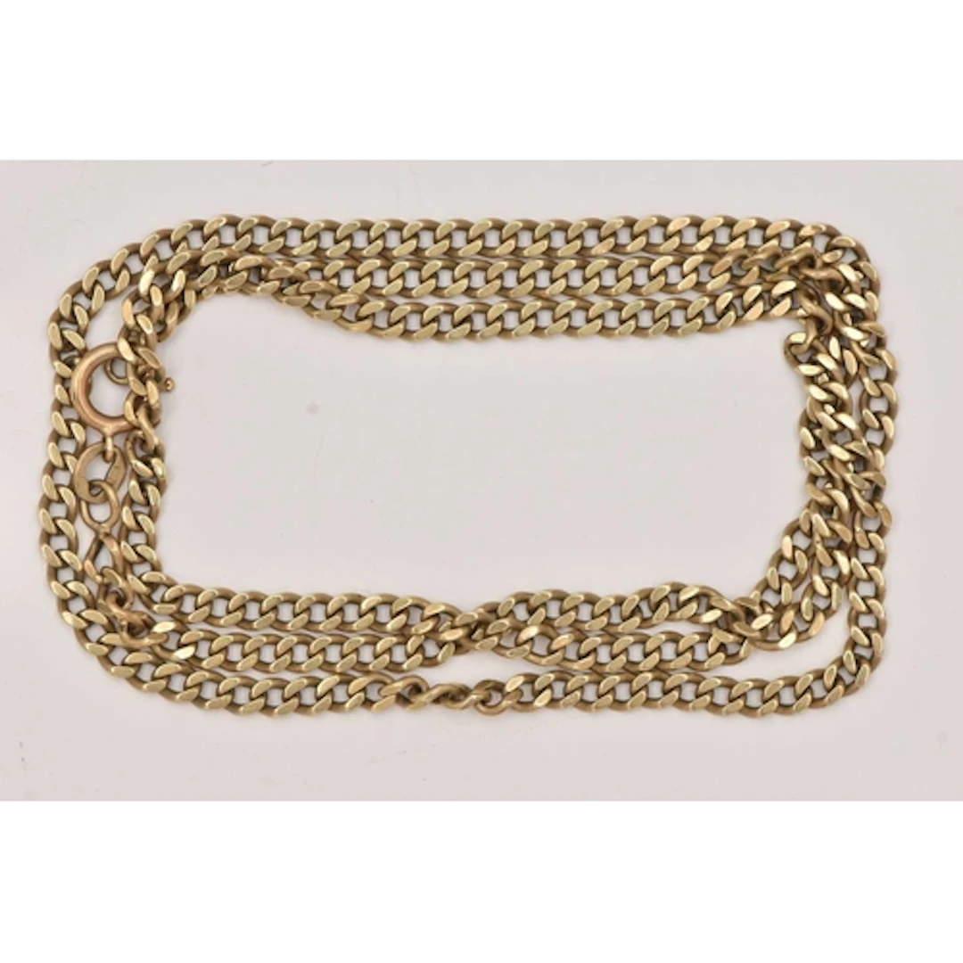 A YELLOW METAL CURB LINK CHAIN NECKLACE, fitted with a sprin...