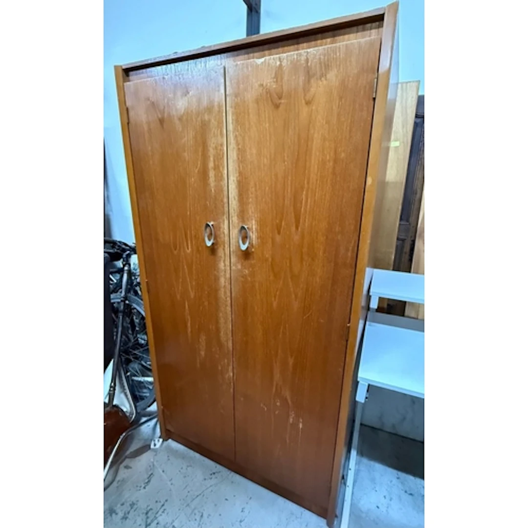A Teak double wardrobe with fitted shelfs and handing space...