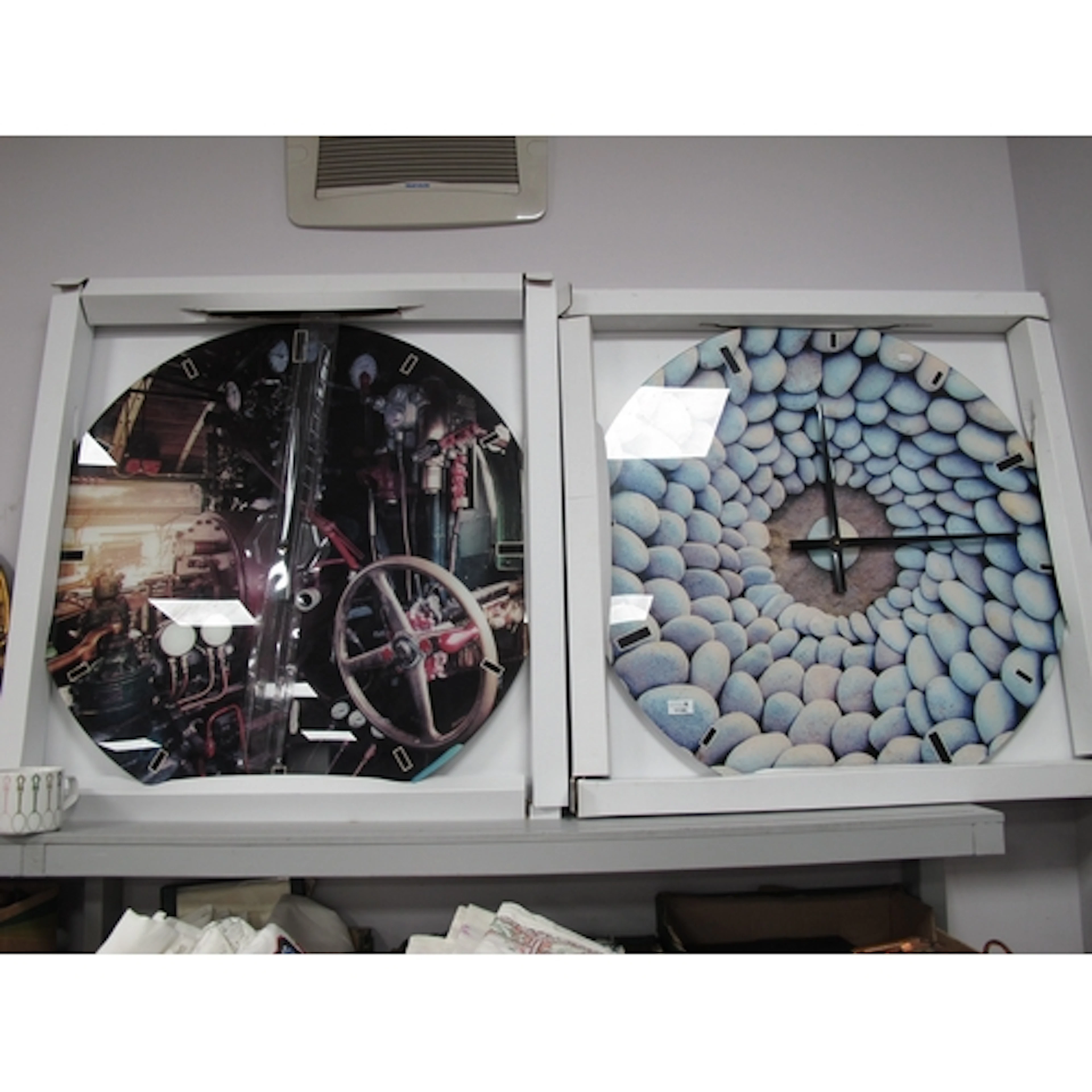 Two large circular glass panel wall clocks by KARE Design, i...