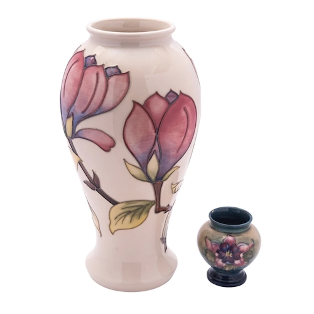 A John Moorcroft pottery baluster vase tube lined in the Mag...