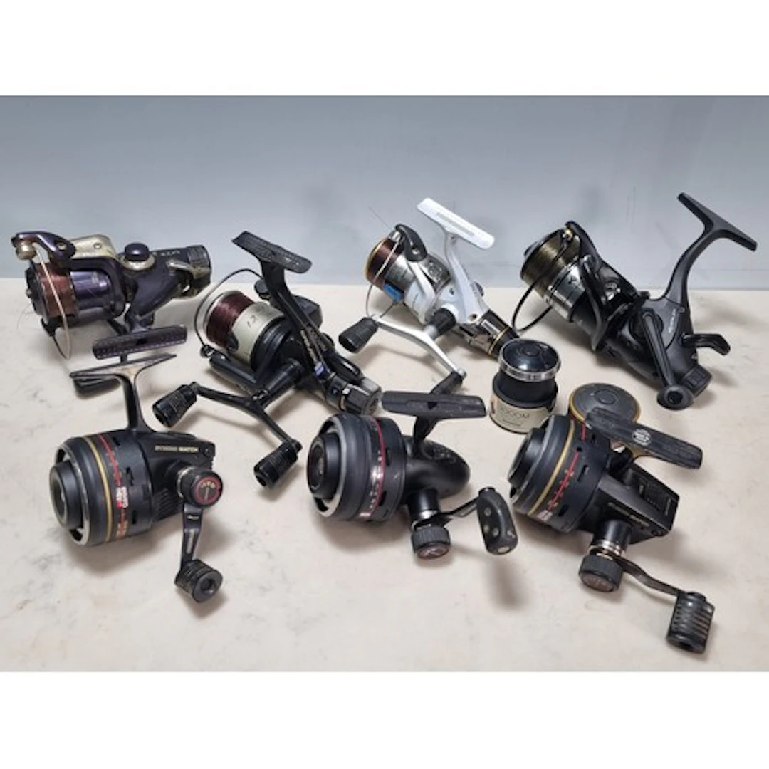 Seven assorted Fishing Reels to include, a Shimano 4000 GTM,...