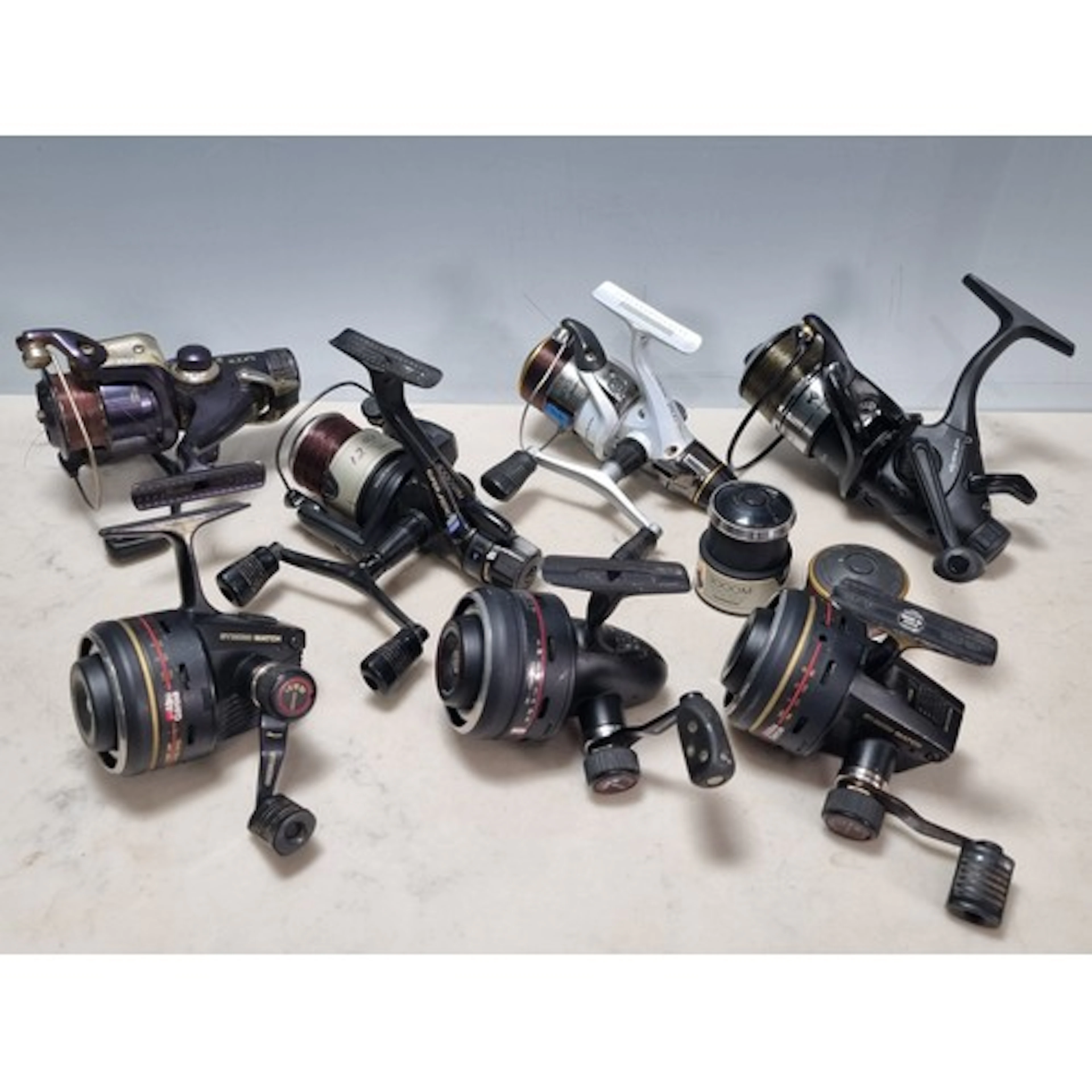 Seven assorted Fishing Reels to include, a Shimano 4000 GTM,...