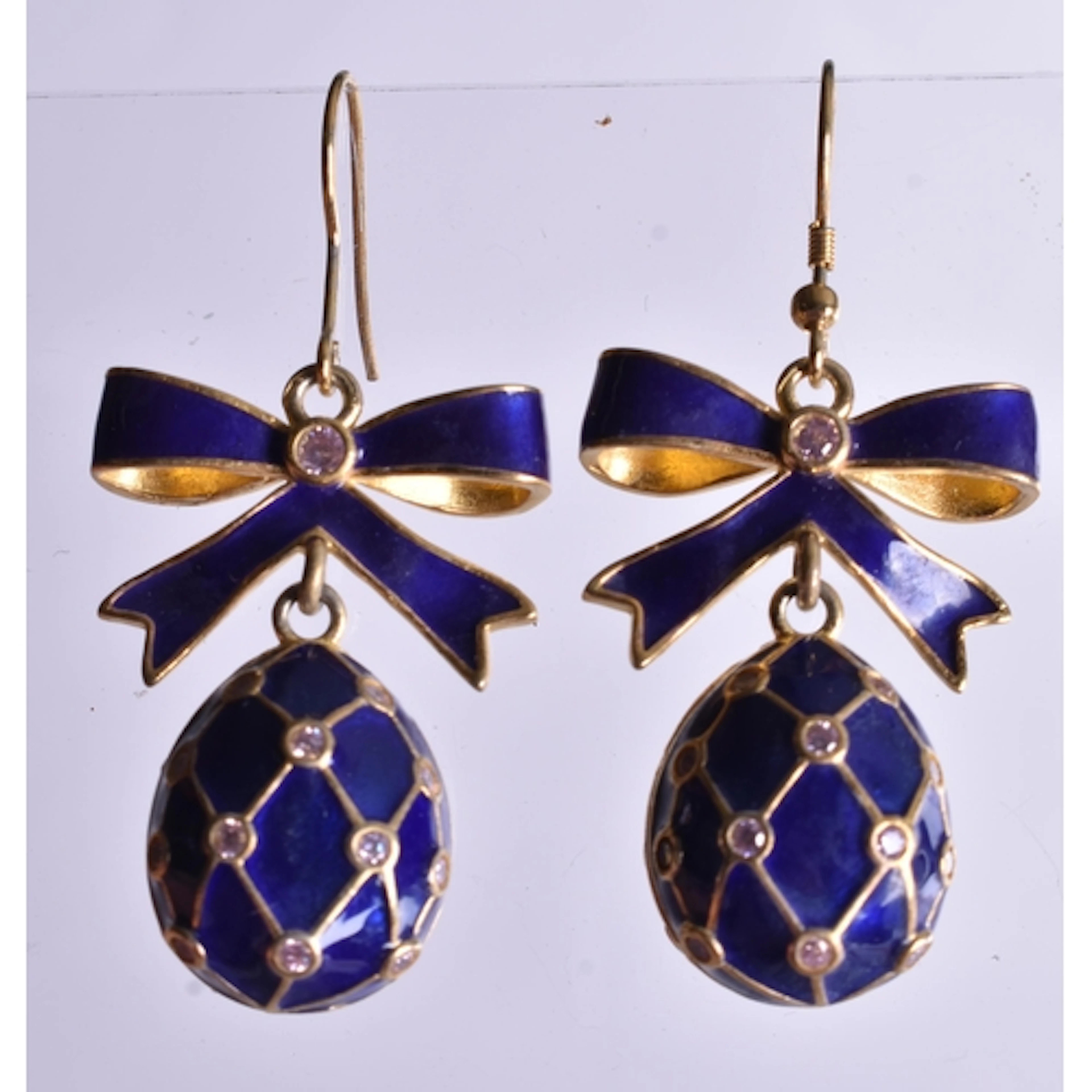 A Pair of Continental Silver and Blue Enamel Easter Egg and ...