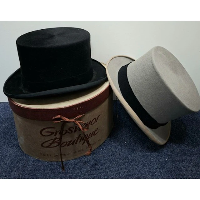 Two top hats comprising a Scott & Co grey felt top hat 16.5c...