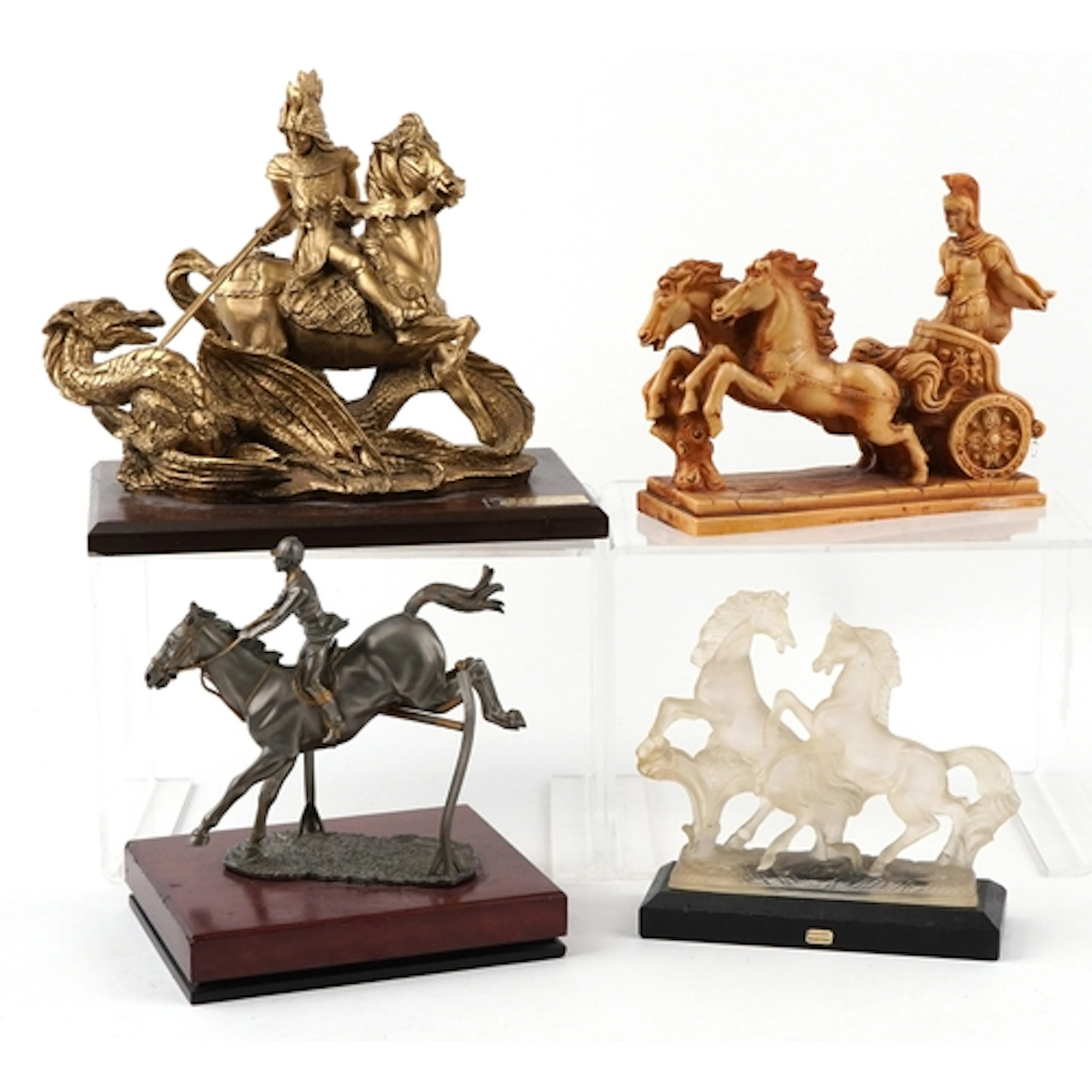 Four decorative horse models including St. George and the Dr...