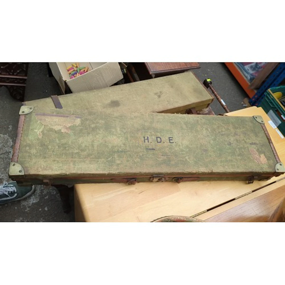 Gun case leather fittings and a fitted green-baize interior,...