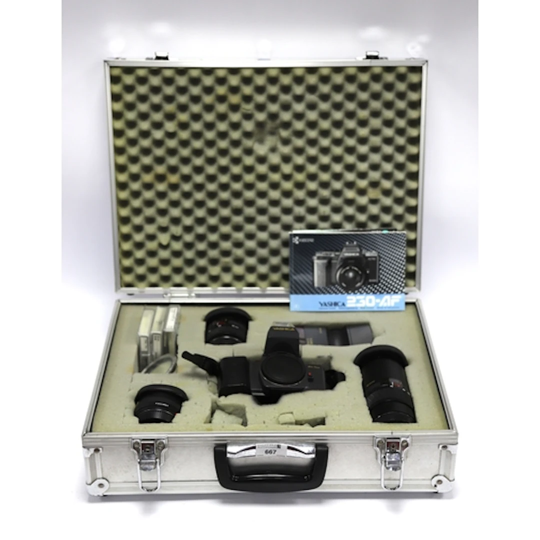 Yashica 250-AF 35mm SLR Film Camera Body together with a Yas...