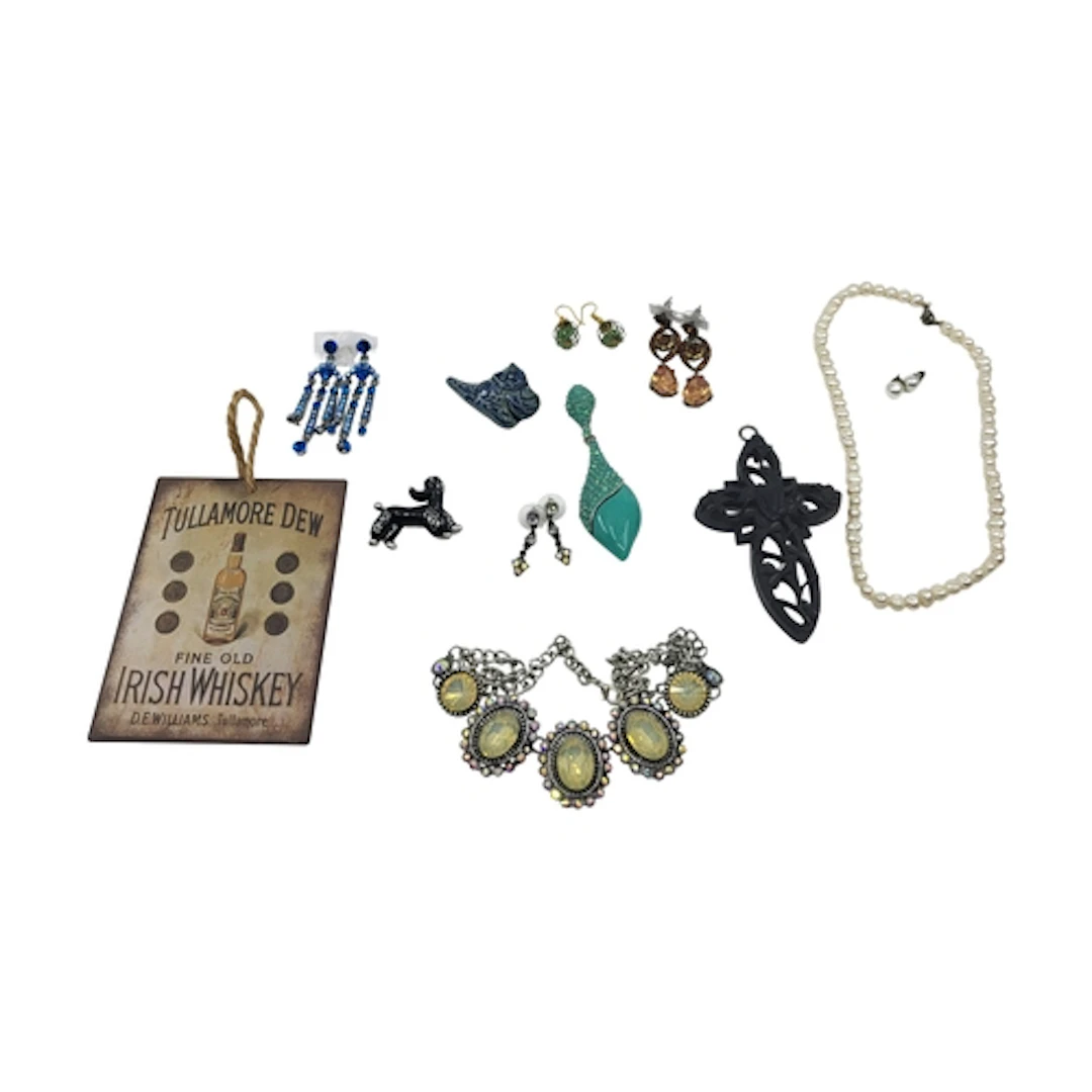 A COLLECTION OF COSTUME JEWELLERY, to include a carved Irish...