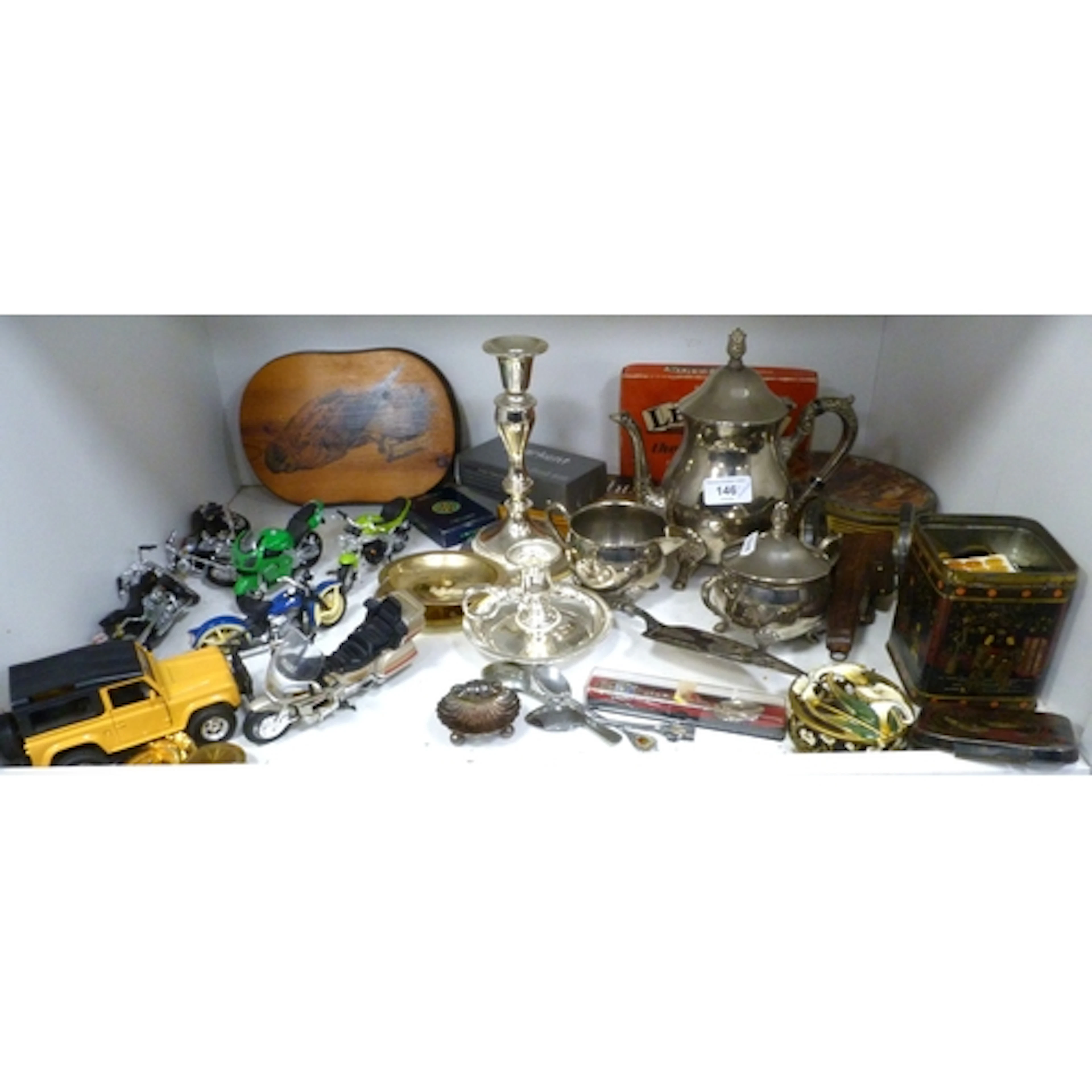 Shelf of sundries to include plated tea set, model motorbike...